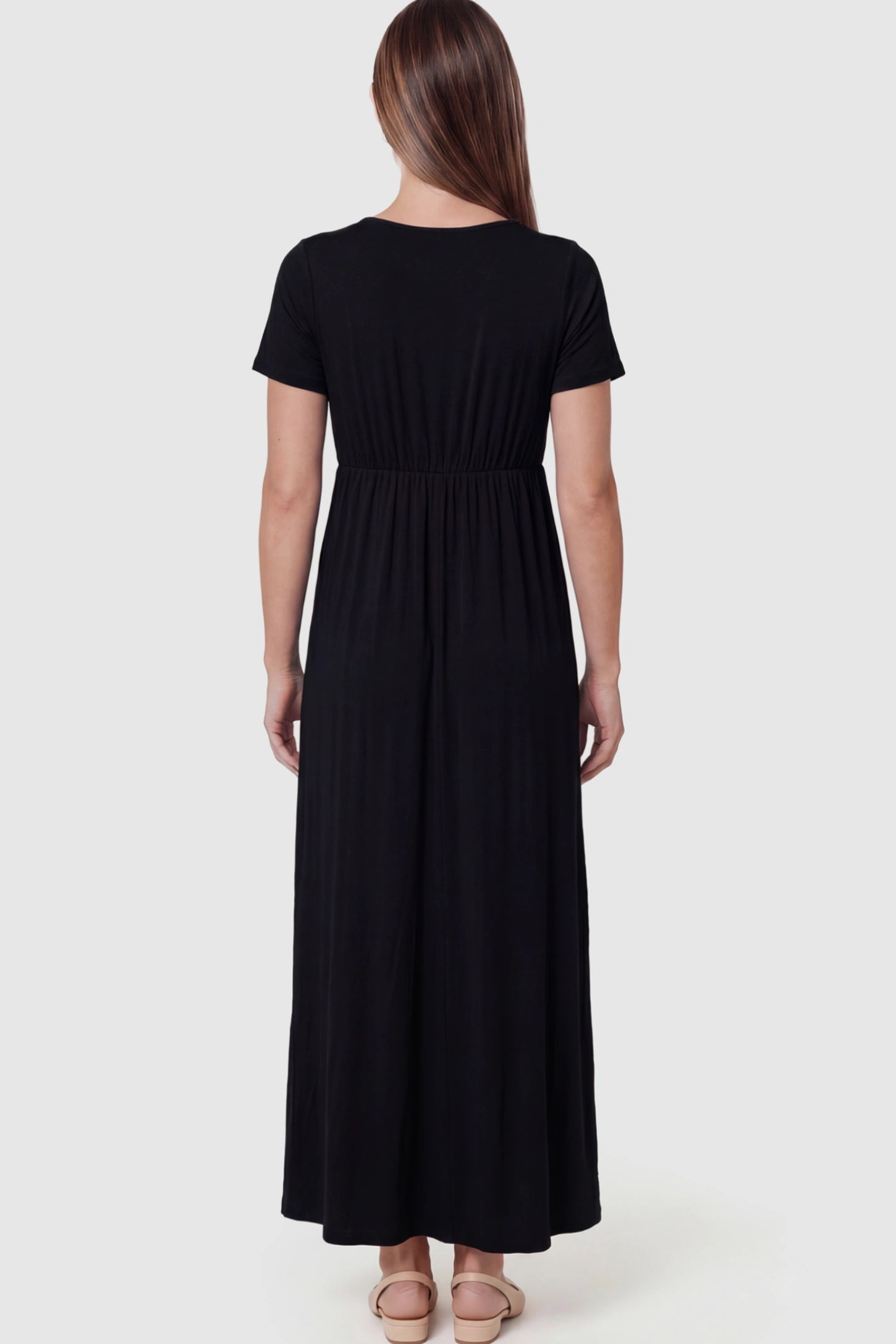 Cotton V-Neck Short Sleeve Maternity Maxi Dress Solid V-Neck Maxi Maternity Dress in black featuring breathable cotton on a pregnant model showing back.