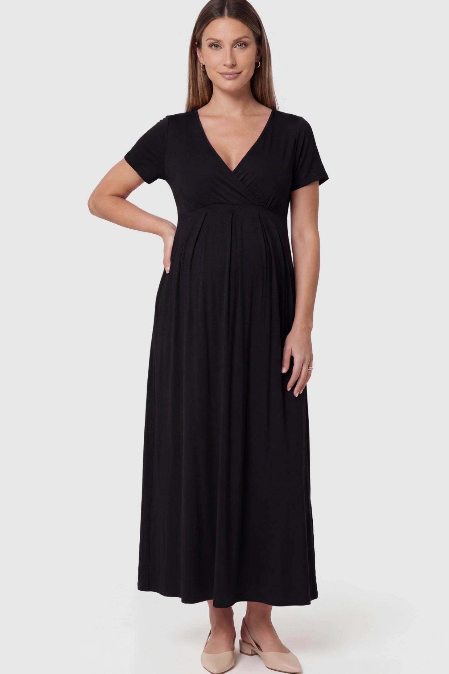 Cotton V-Neck Short Sleeve Maternity Maxi Dress Solid V-Neck Maxi Maternity Dress in black featuring breathable cotton and a deep neckline on a pregnant model showing front.