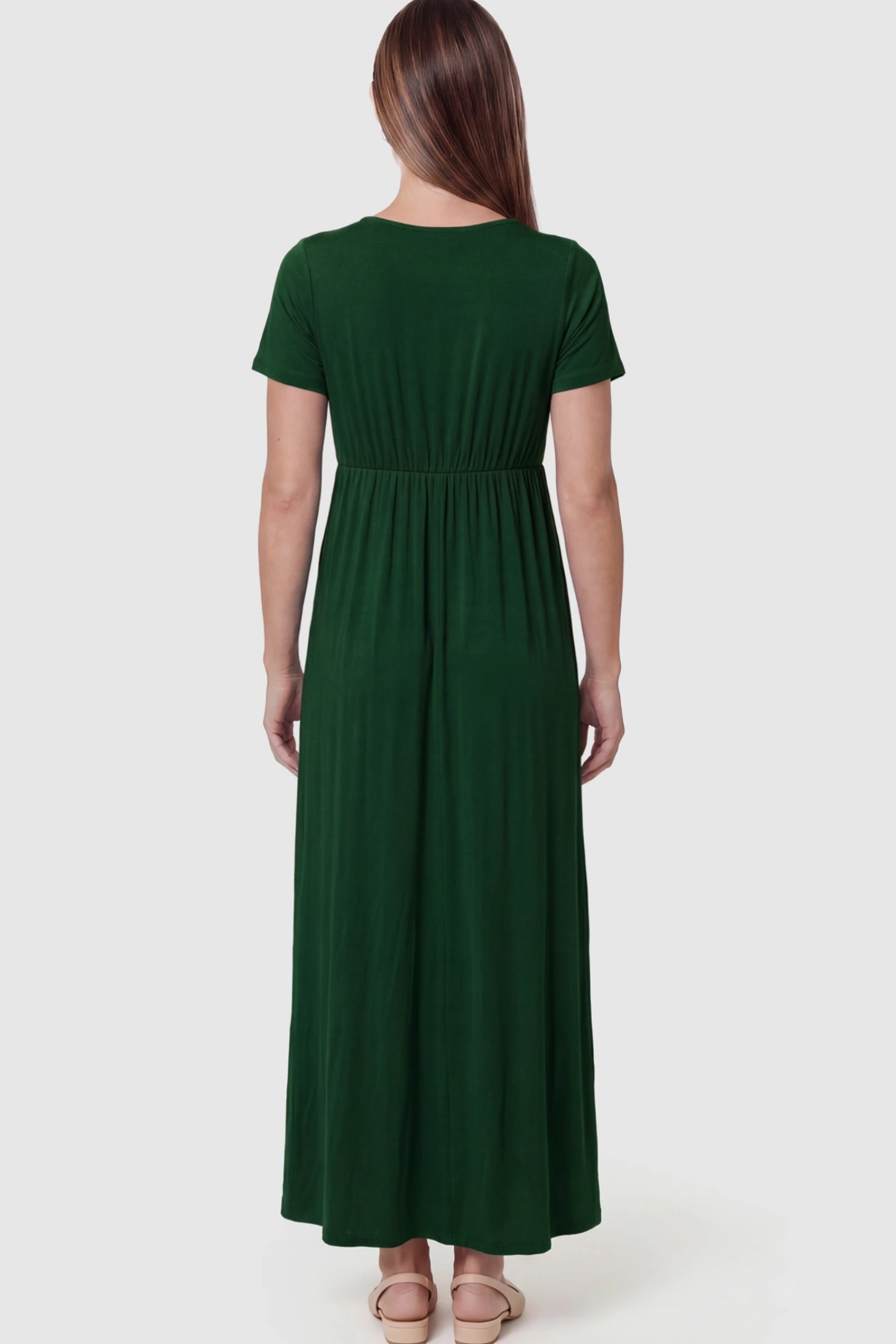 Cotton V-Neck Short Sleeve Maternity Maxi Dress Solid V-Neck Maxi Maternity Dress in dark green featuring breathable cotton on a pregnant model showing back.