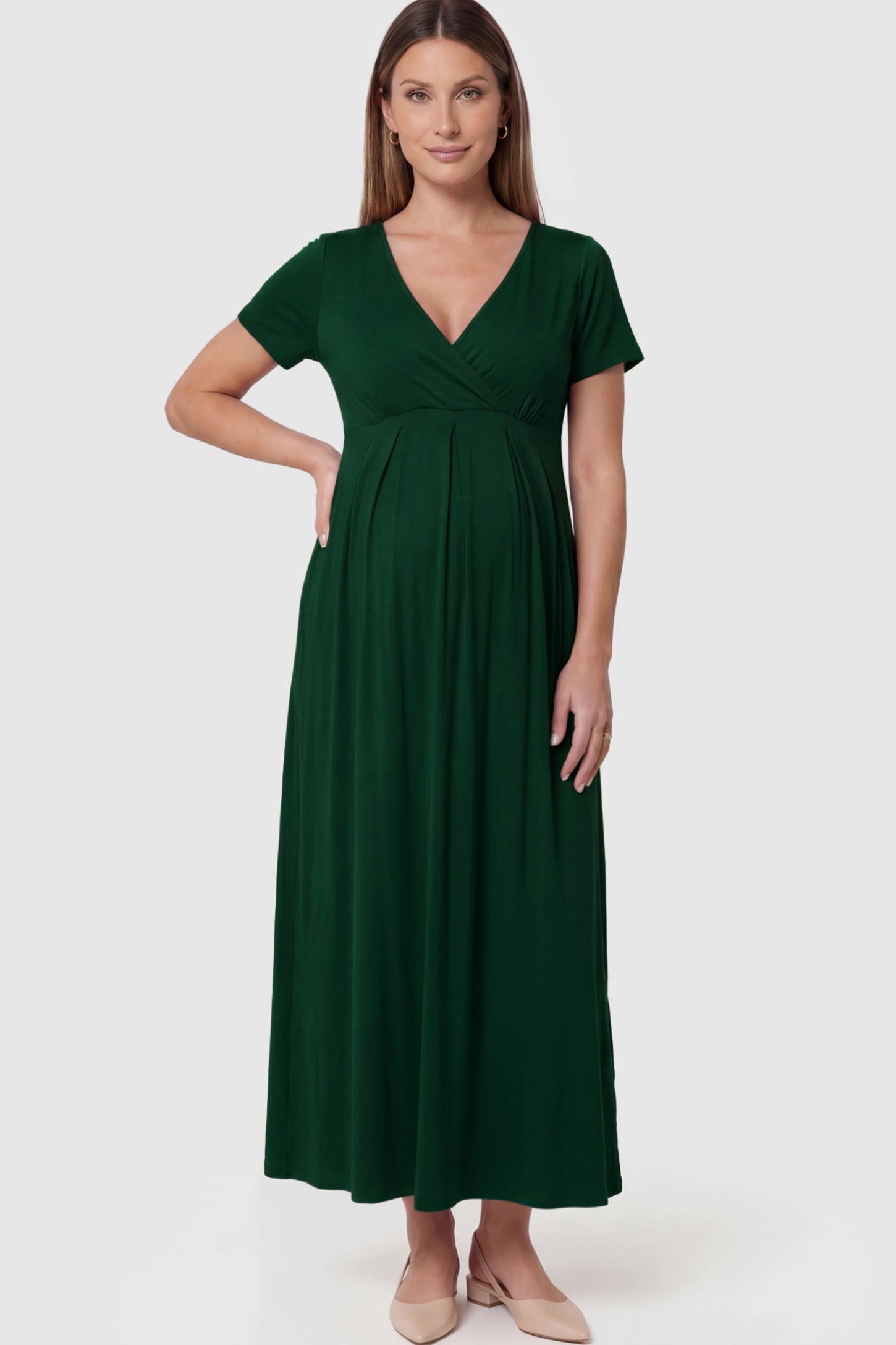 Cotton V-Neck Short Sleeve Maternity Maxi Dress Solid V-Neck Maxi Maternity Dress in dark green featuring breathable cotton and a deep neckline on a pregnant model showing front.