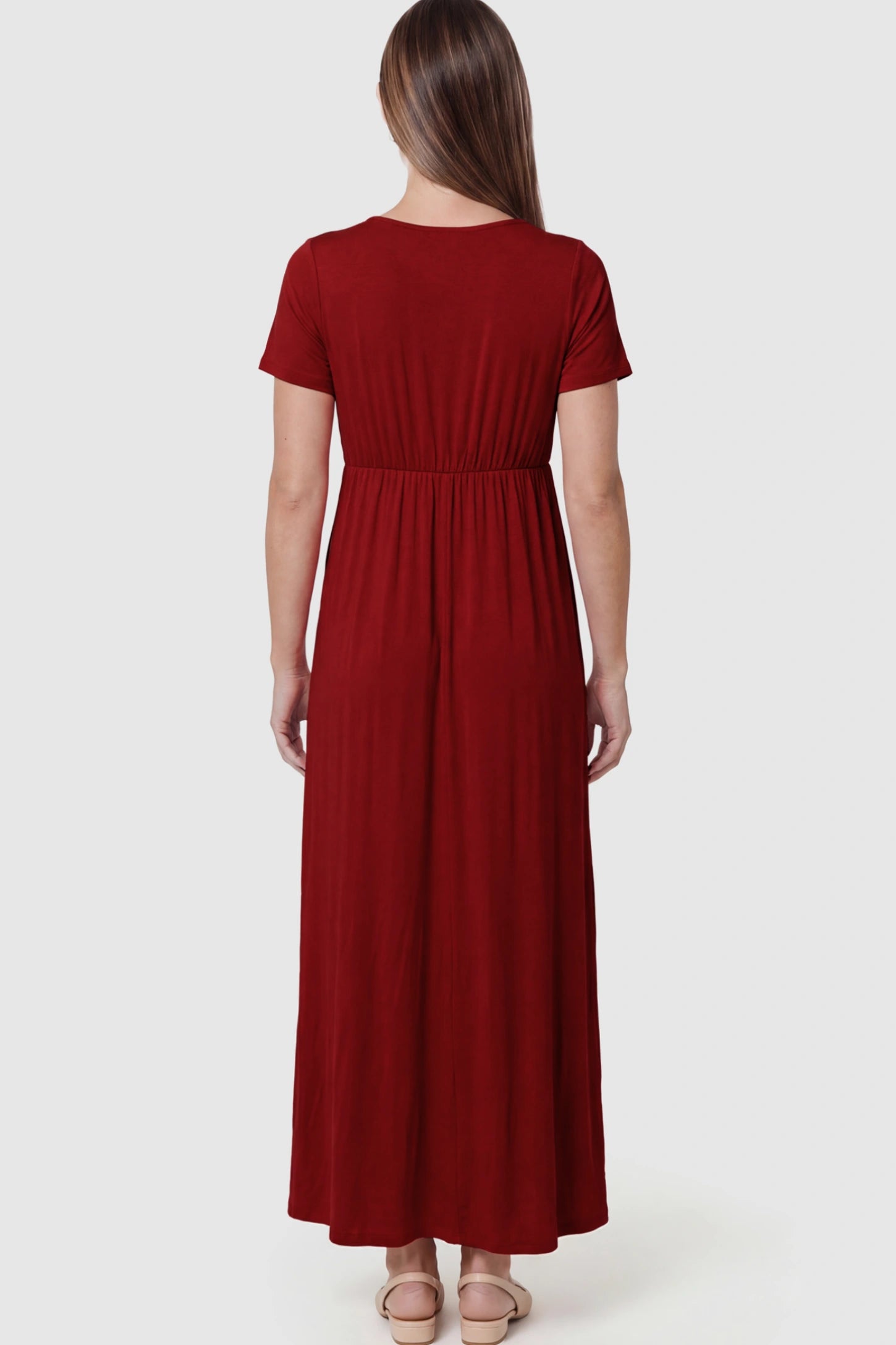 Cotton V-Neck Short Sleeve Maternity Maxi Dress Solid V-Neck Maxi Maternity Dress in dark red featuring breathable cotton on a pregnant model showing back.