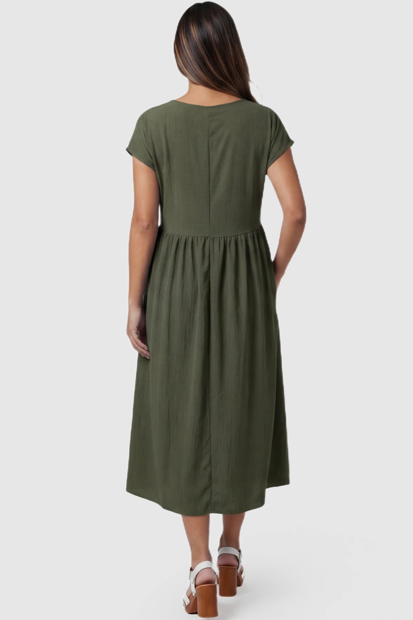 Crew Neck Short Sleeve Maternity Midi Dress Crew Neck Short Sleeve Maternity Midi Dress in Army Green featuring a flowy shift silhouette on a pregnant model, back view.
