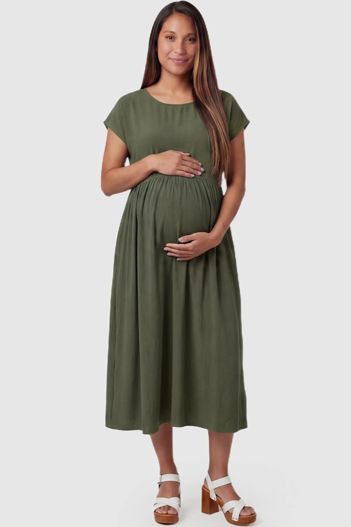 Crew Neck Short Sleeve Maternity Midi Dress Crew Neck Short Sleeve Maternity Midi Dress in Army Green featuring a flowy shift silhouette on a pregnant model, front view.