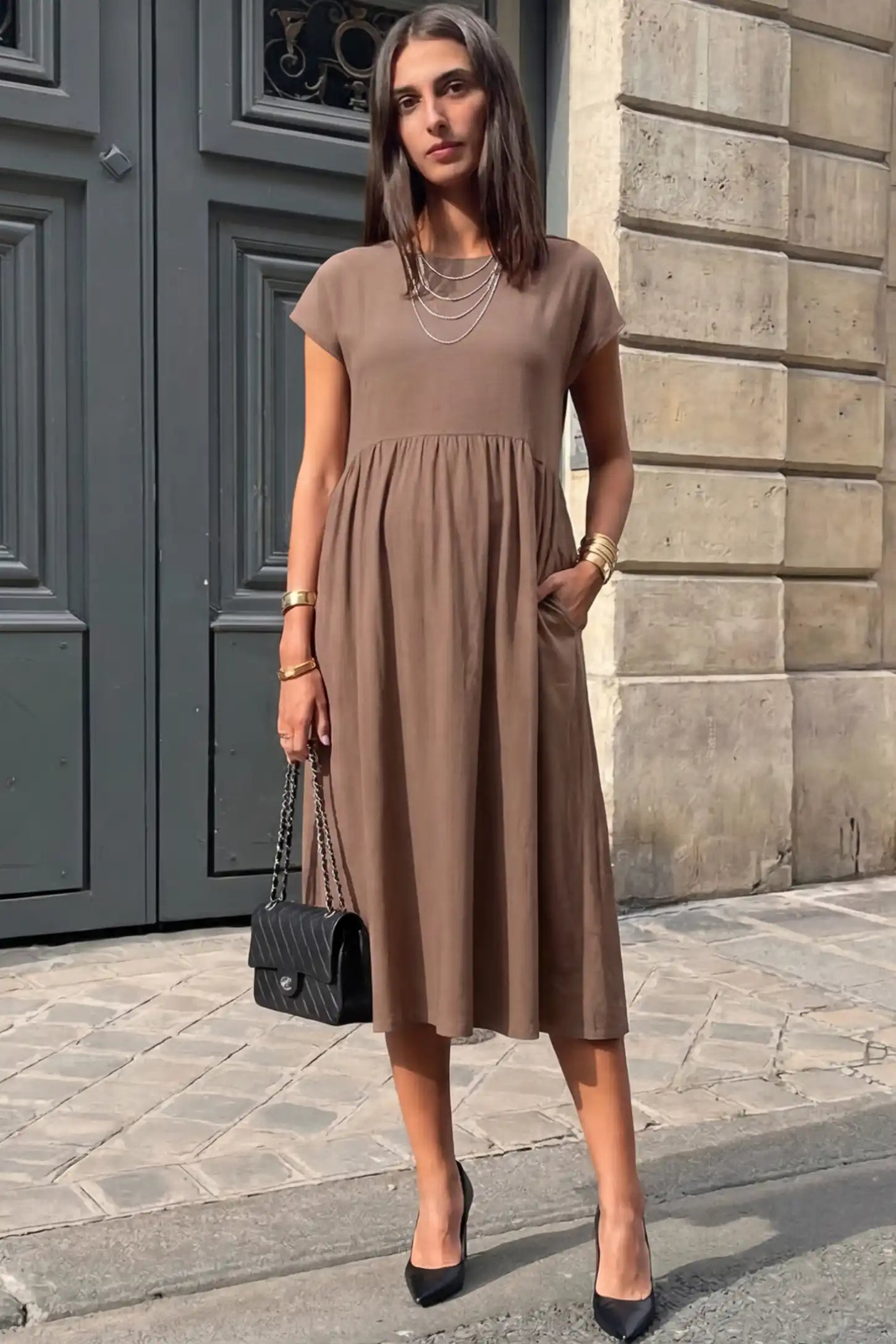 Crew Neck Short Sleeve Maternity Midi Dress Crew Neck Short Sleeve Maternity Midi Dress in Khaki featuring a flowy shift silhouette on a pregnant woman, front view.