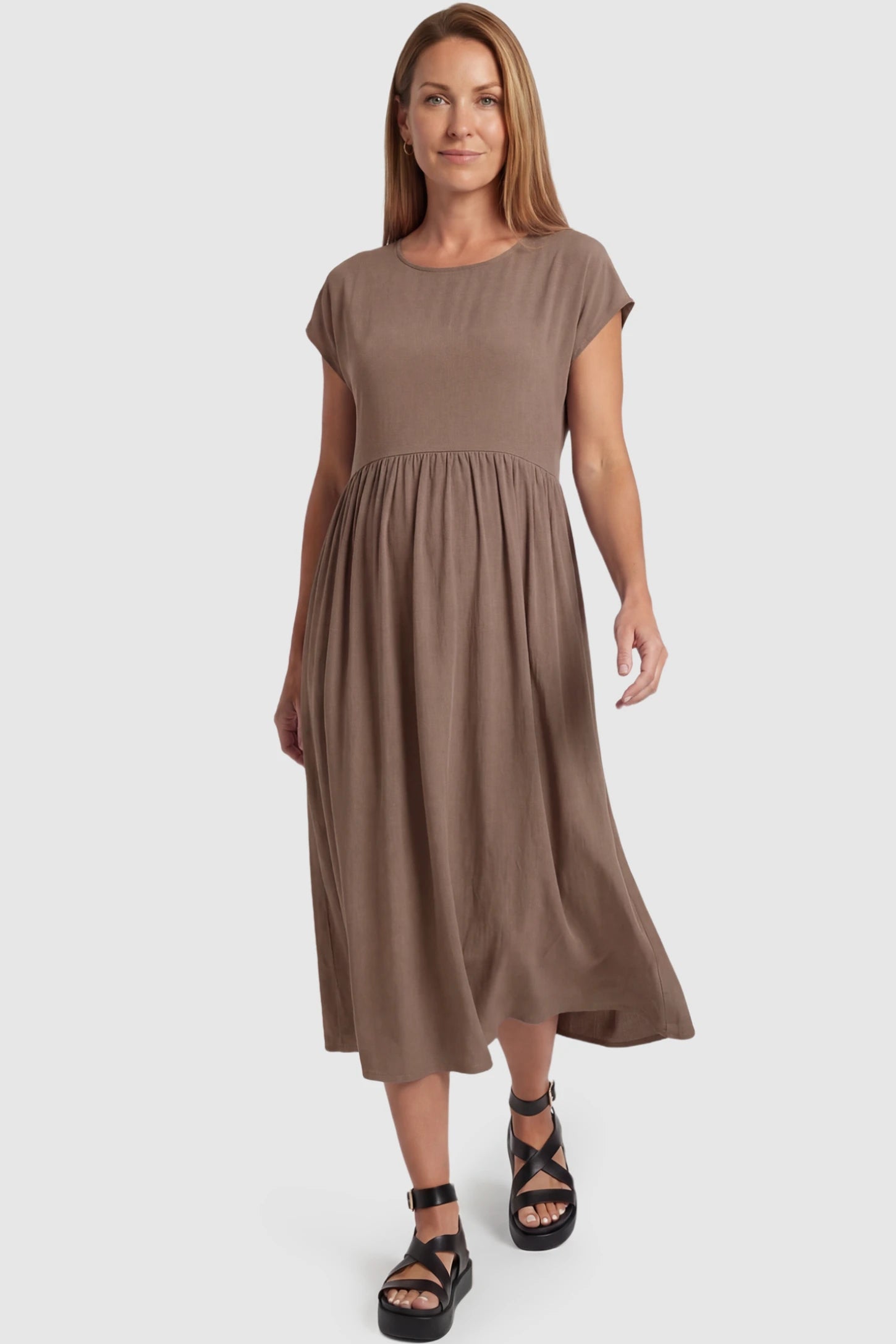 Crew Neck Short Sleeve Maternity Midi Dress Crew Neck Short Sleeve Maternity Midi Dress in Khaki featuring a flowy shift silhouette on a postpartum model, front view.