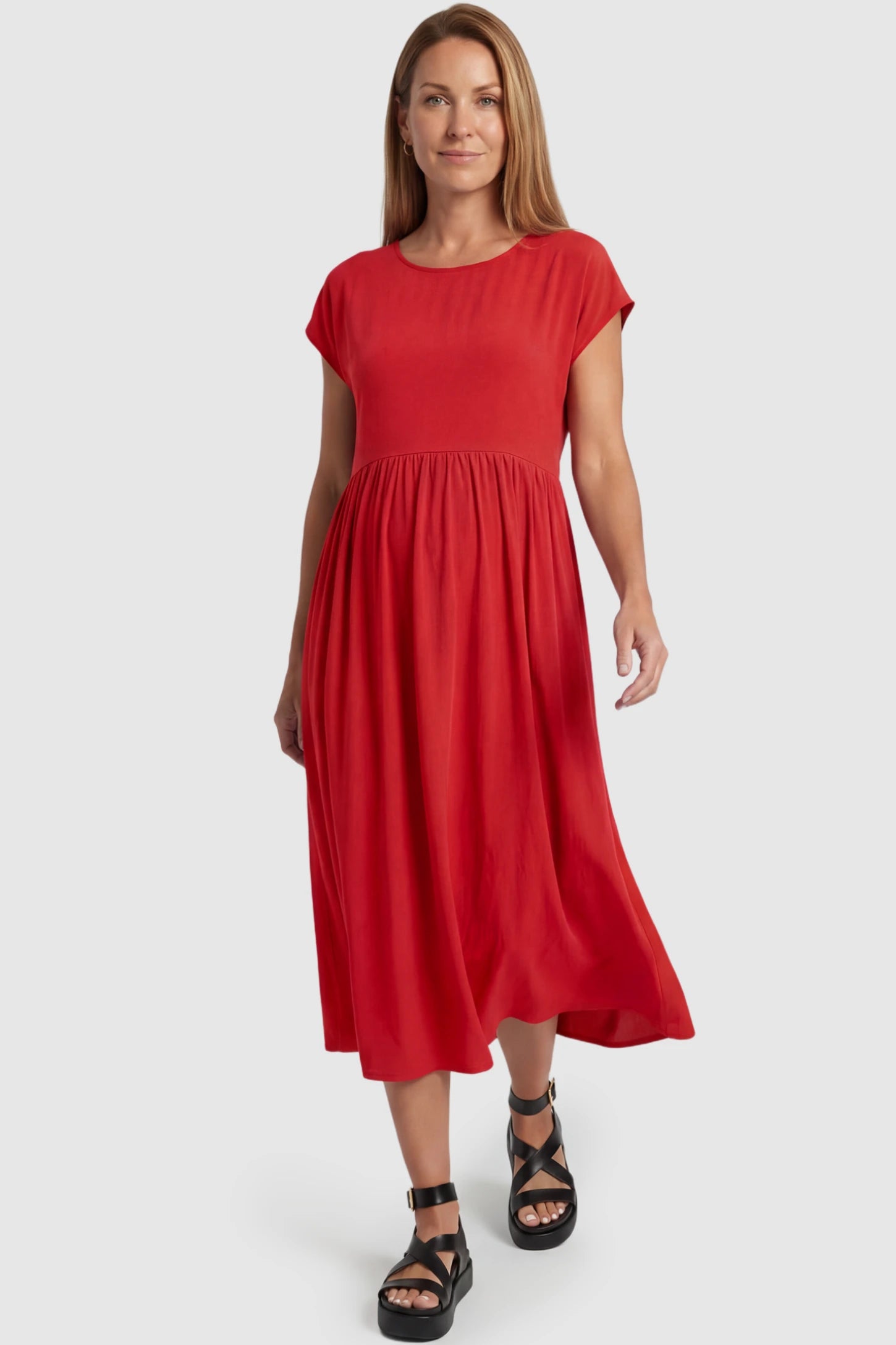 Crew Neck Short Sleeve Maternity Midi Dress Crew Neck Short Sleeve Maternity Midi Dress in Red featuring a flowy shift silhouette on a postpartum model, front view.