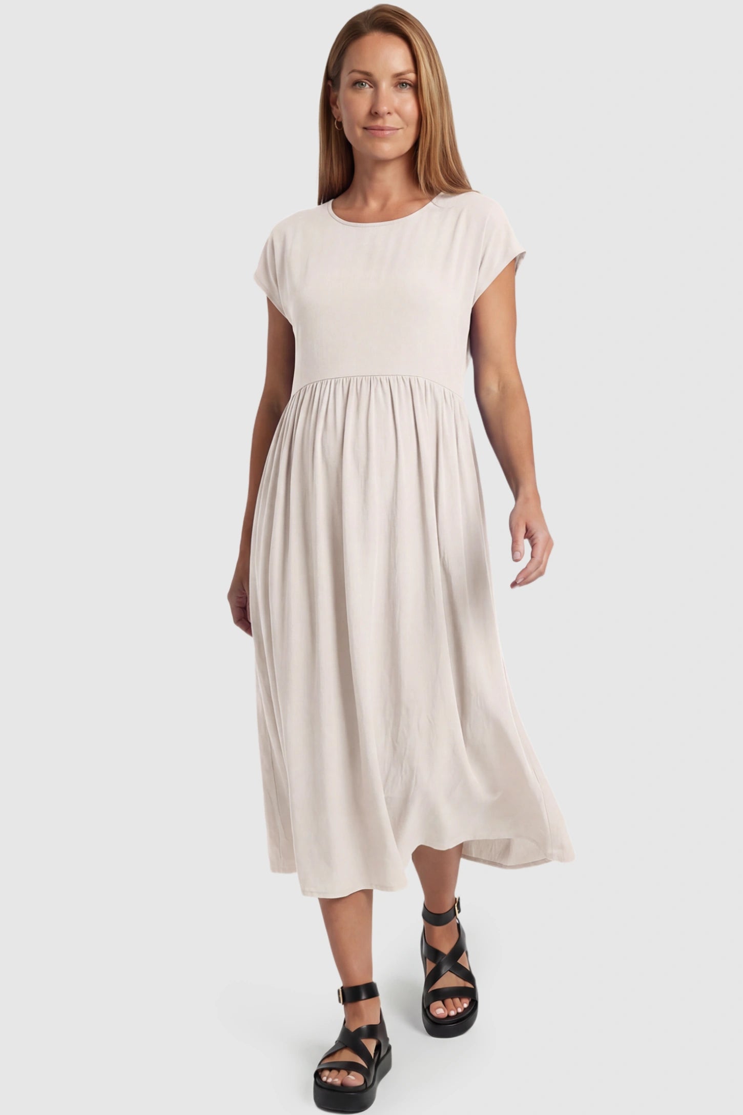 Crew Neck Short Sleeve Maternity Midi Dress Crew Neck Short Sleeve Maternity Midi Dress in White featuring a flowy shift silhouette on a postpartum model, front view.