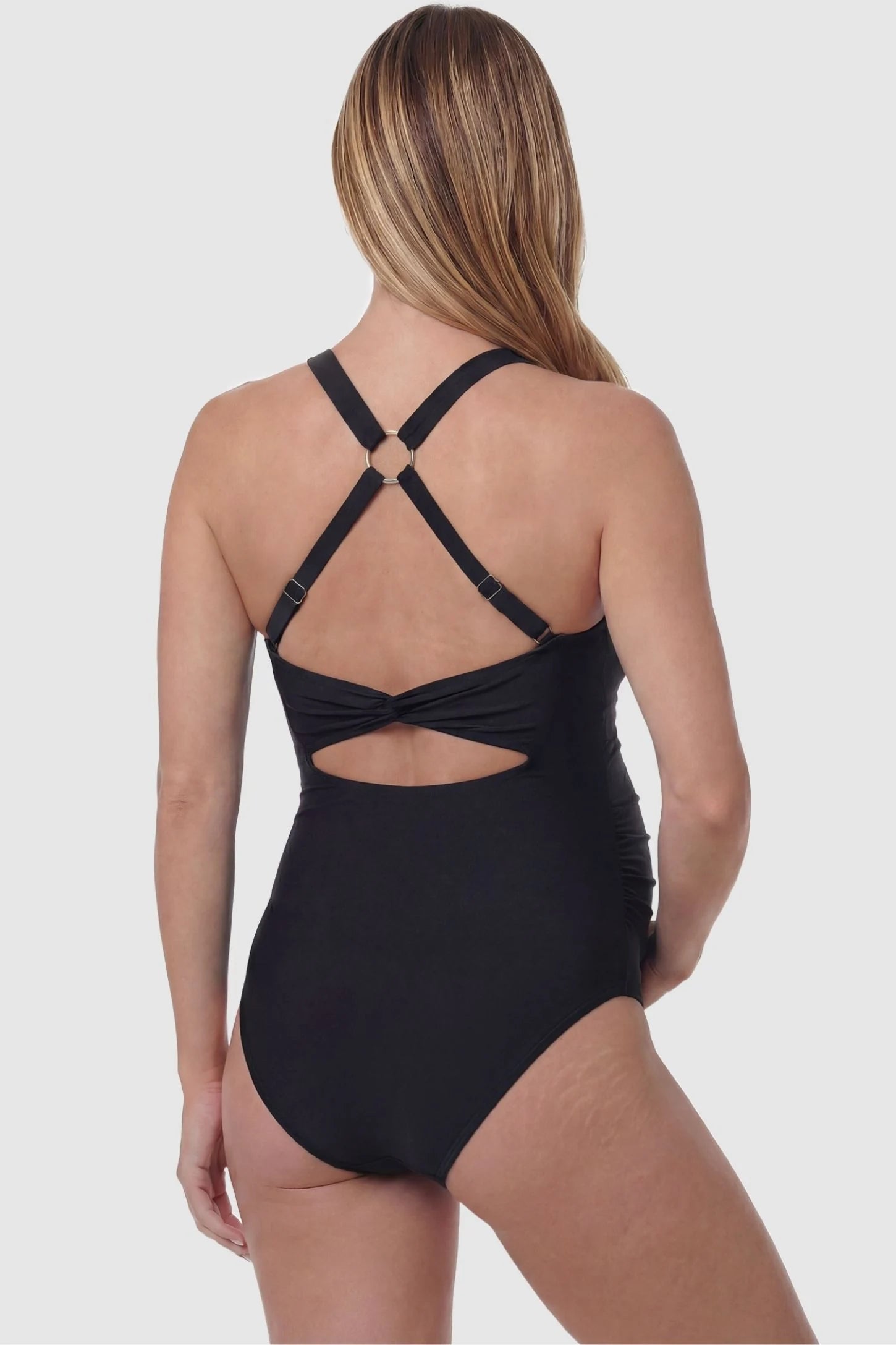 Criss-Cross Back Twist-Front Maternity One-Piece Criss-Cross Back Twist-Front Maternity One-Piece in Black featuring an adjustable O-ring back on a pregnant model, back view.