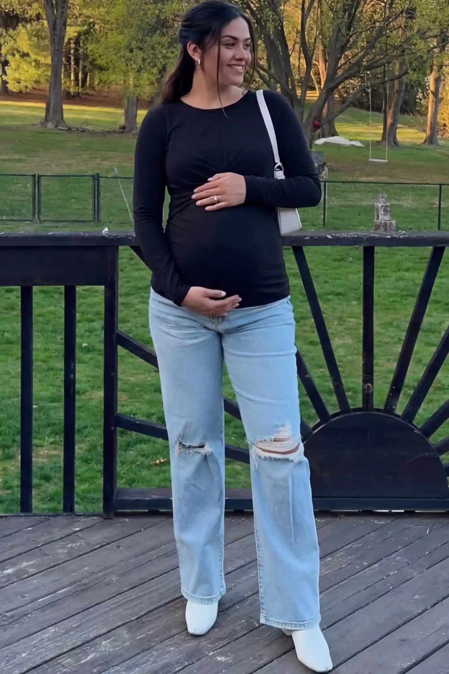 Cross Front Long Sleeve Maternity Top Cross Front Long Sleeve Maternity Top in Black featuring a crossover waist detail on a pregnant woman.