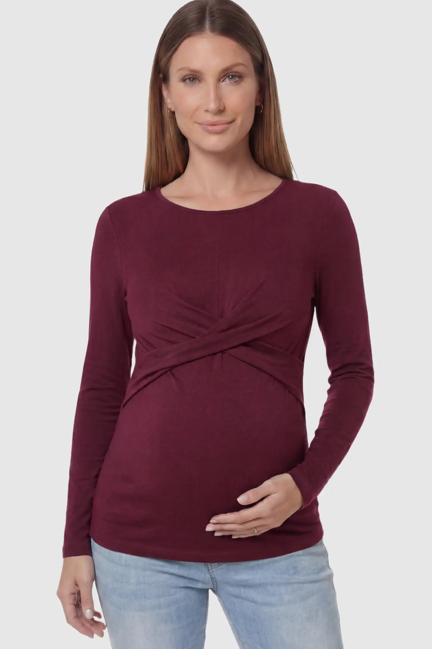 Cross Front Long Sleeve Maternity Top in Dark Purple featuring a crossover waist detail on a pregnant model showing front.