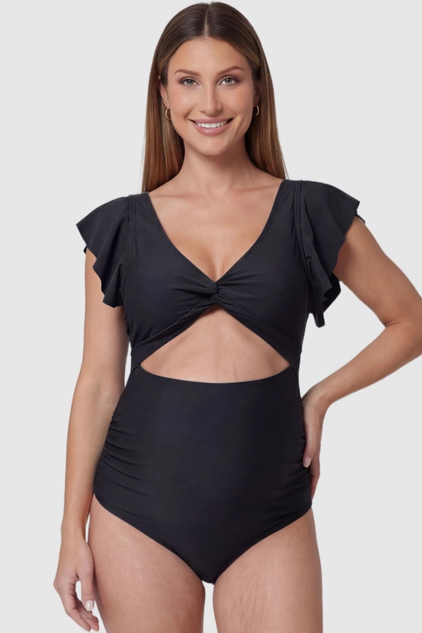 Cutout Twist-Front Maternity Monokini Cutout Twist-Front Maternity Monokini in Black featuring a supportive twist-front knot on a pregnant model, front view.