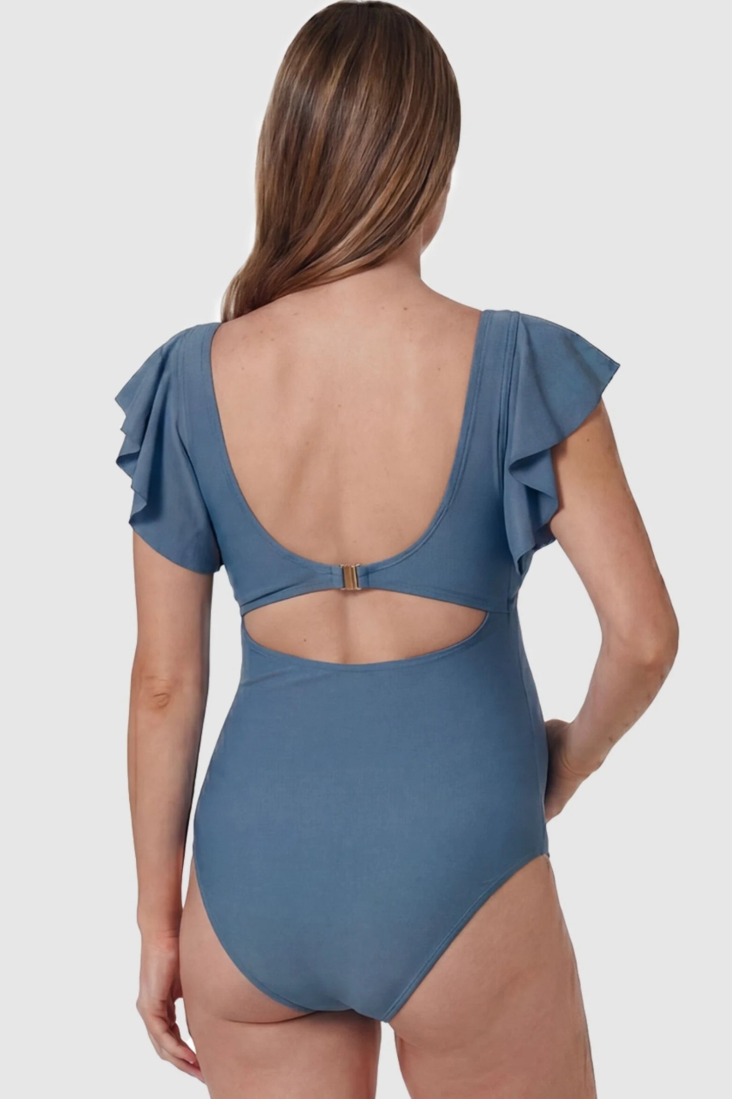 Cutout Twist-Front Maternity Monokini Cutout Twist-Front Maternity Monokini in Blue featuring a secure gold clasp closure on a pregnant model, back view.