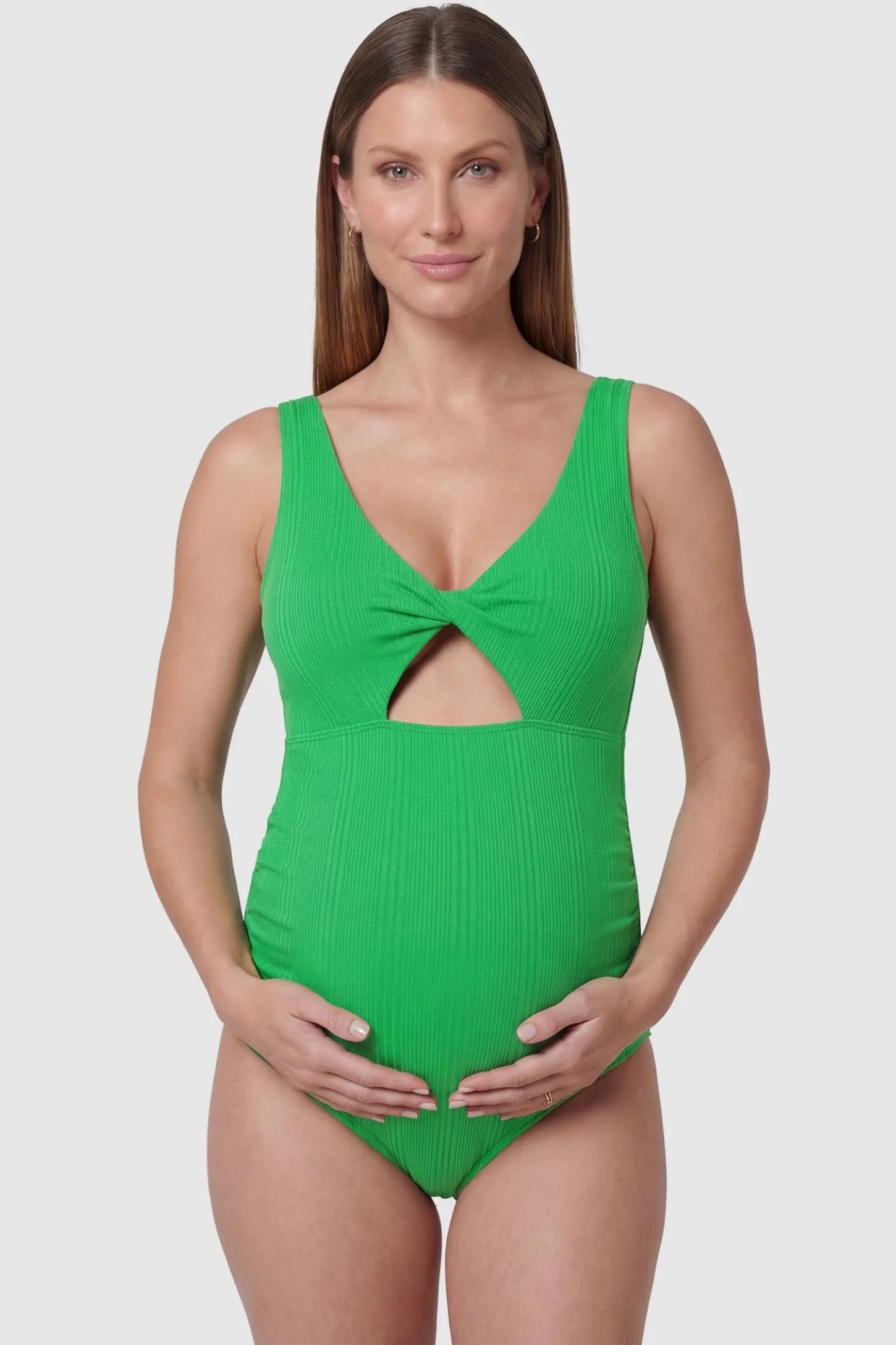 Cutout Twisted V-Neck Maternity Swimsuit Cutout Twisted V-Neck Maternity Swimsuit in Green featuring a front view with a knotted bust on a pregnant model.