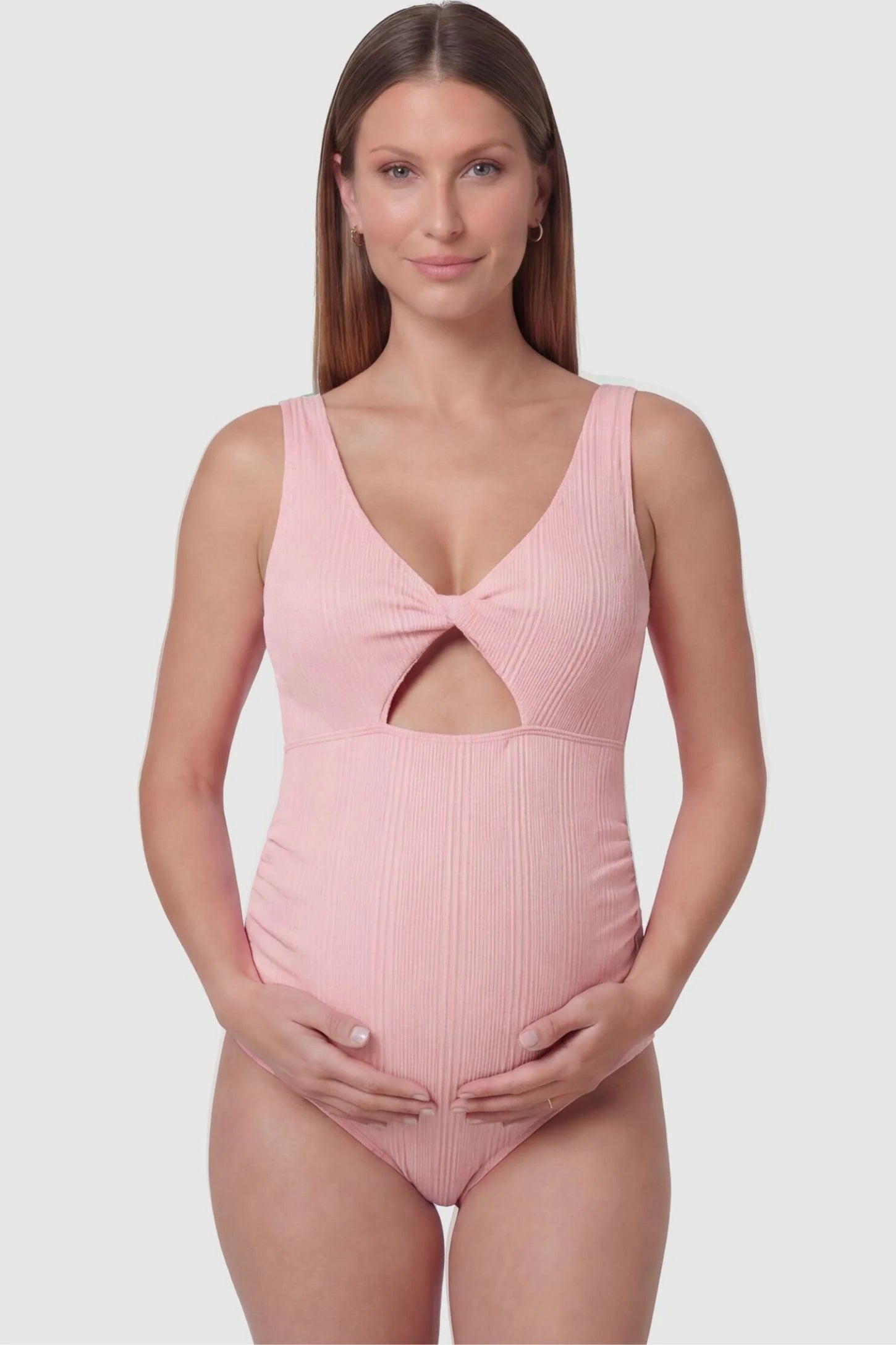 Cutout Twisted V-Neck Maternity Swimsuit Cutout Twisted V-Neck Maternity Swimsuit in Pink featuring a front view with a knotted bust on a pregnant model.