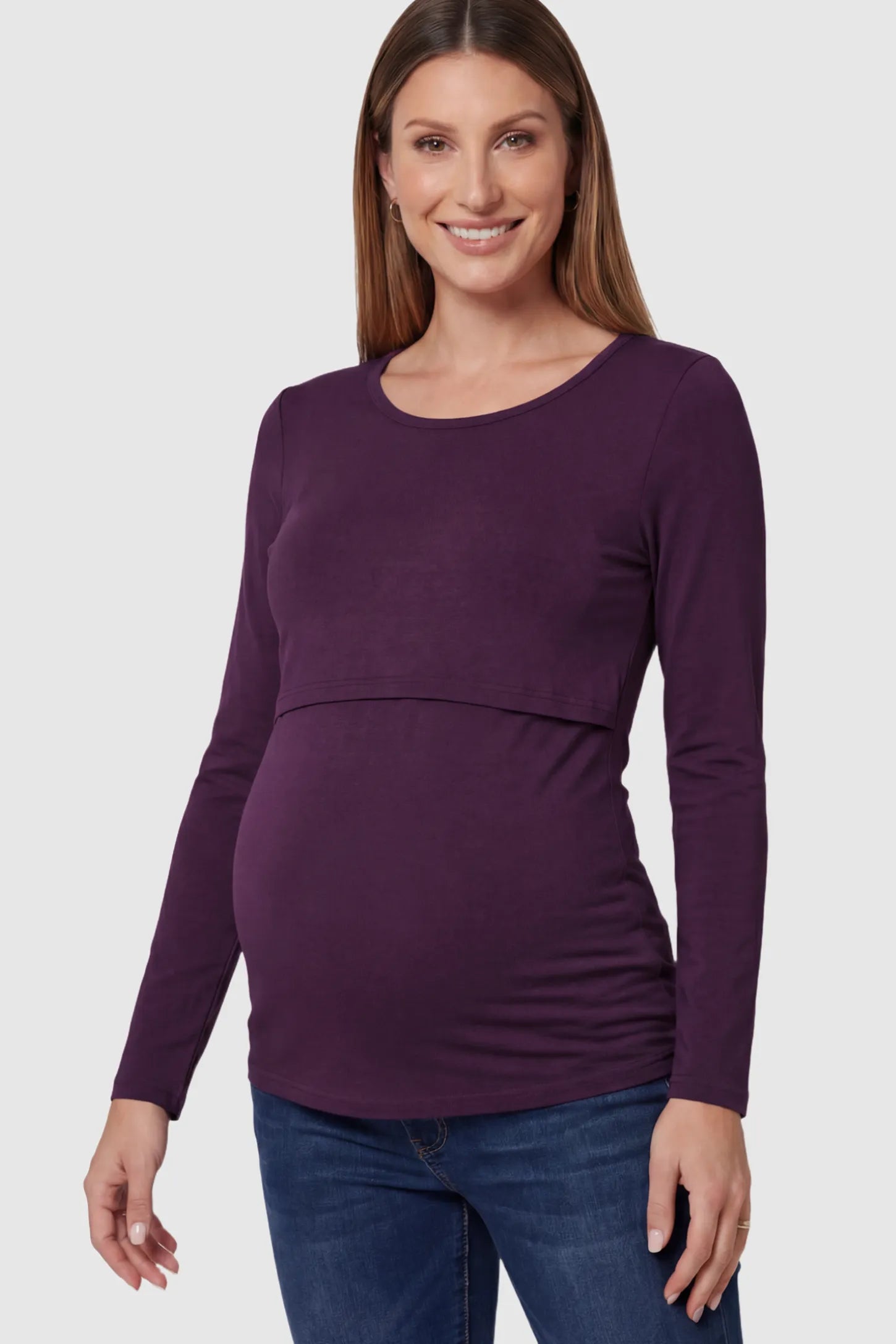 Double Layer Long Sleeve Maternity Nursing Top Double Layer Long Sleeve Maternity & Nursing Top in dark purple with a discrete lift-up access on a pregnant model.