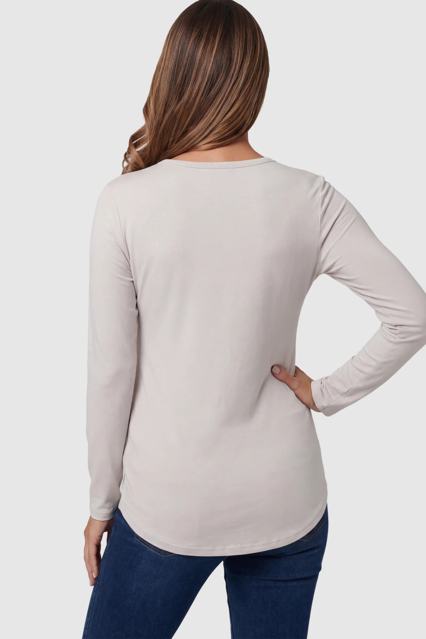 Double Layer Long Sleeve Maternity Nursing Top Double Layer Long Sleeve Maternity & Nursing Top in light apricot with a discrete lift-up access on a pregnant model showing back.