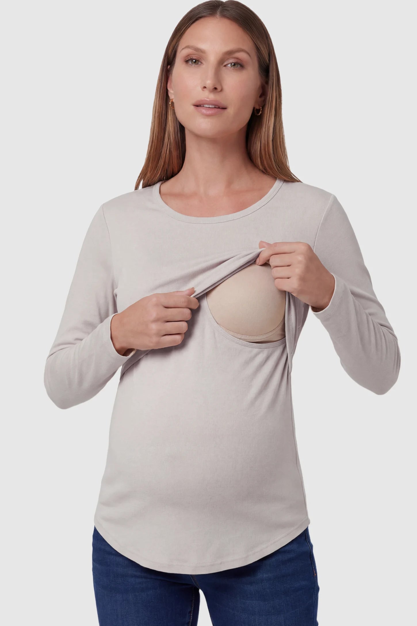 Double Layer Long Sleeve Maternity Nursing Top Double Layer Long Sleeve Maternity & Nursing Top in Light Apricot with a discrete lift-up access on a pregnant model.