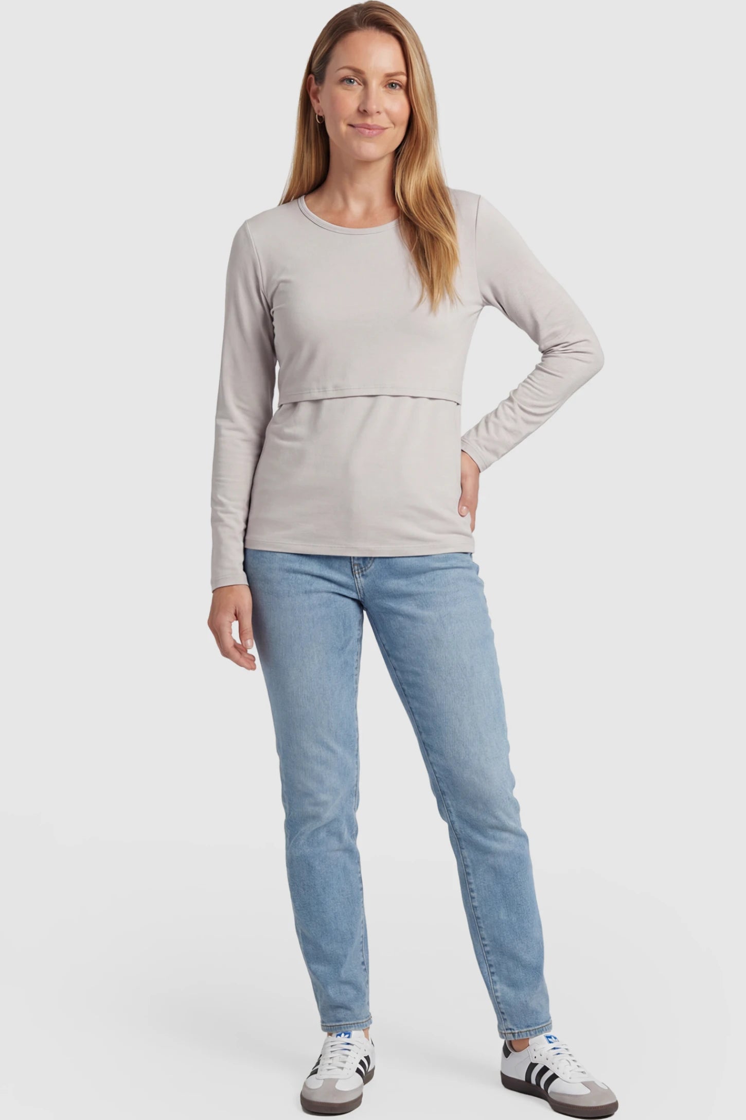 Double Layer Long Sleeve Maternity Nursing Top Double Layer Long Sleeve Maternity & Nursing Top in Light Apricot with a discrete lift-up access on a postpartum model.