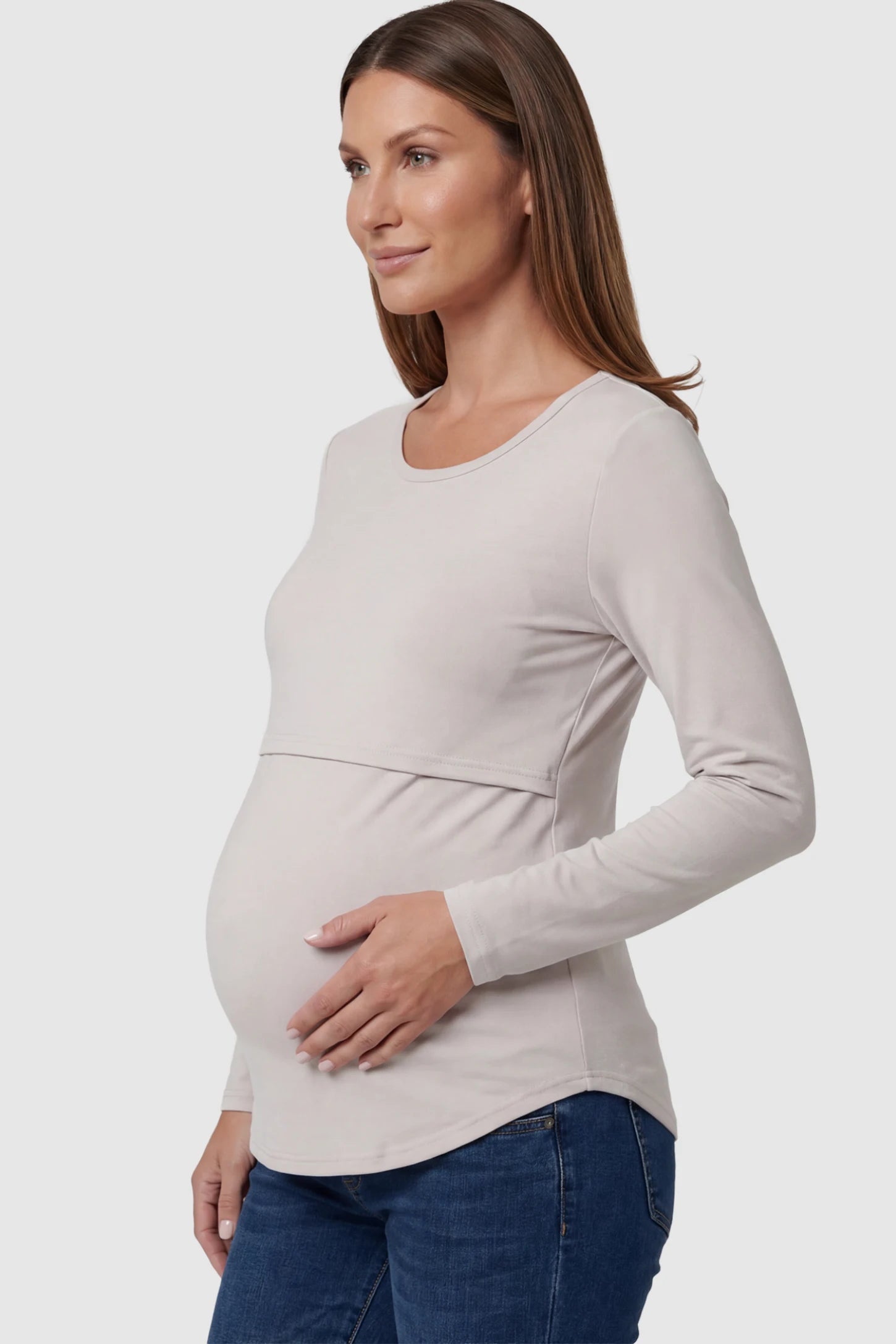 Double Layer Long Sleeve Maternity Nursing Top Double Layer Long Sleeve Maternity & Nursing Top in light apricot with a discrete lift-up access on a pregnant model showing side.