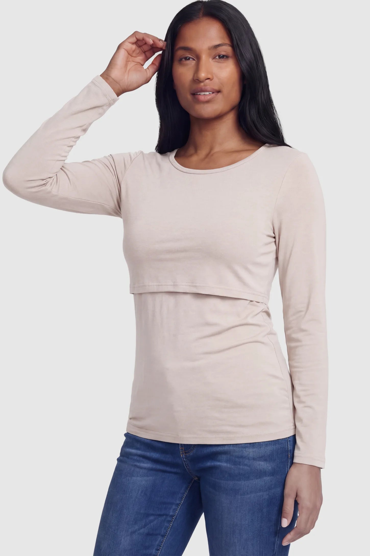 Double Layer Long Sleeve Maternity Nursing Top Double Layer Long Sleeve Maternity & Nursing Top in nude with a discrete lift-up access on a postpartum model.