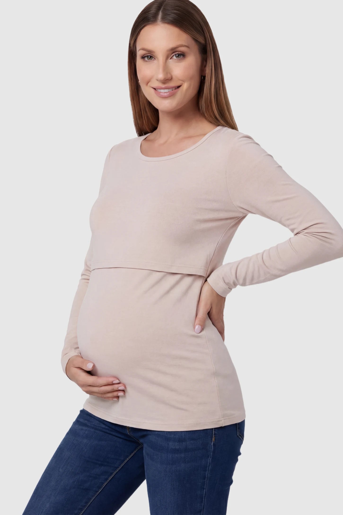 Double Layer Long Sleeve Maternity Nursing Top Double Layer Long Sleeve Maternity & Nursing Top in nude with a discrete lift-up access on a pregnant model showing side.