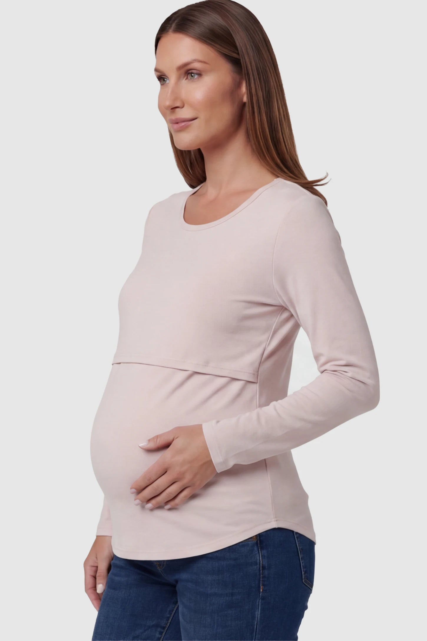 Double Layer Long Sleeve Maternity Nursing Top Double Layer Long Sleeve Maternity & Nursing Top in pink with a discrete lift-up access on a pregnant model showing side.