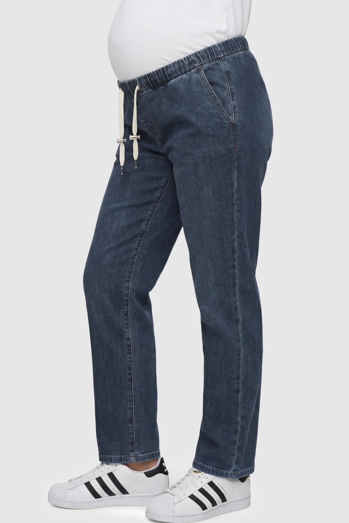 Drawstring Waist Wide Leg Maternity Jeans Drawstring Waist Wide Leg Maternity Jeans in Blue featuring drawstring waistband on a pregnant model showing side.