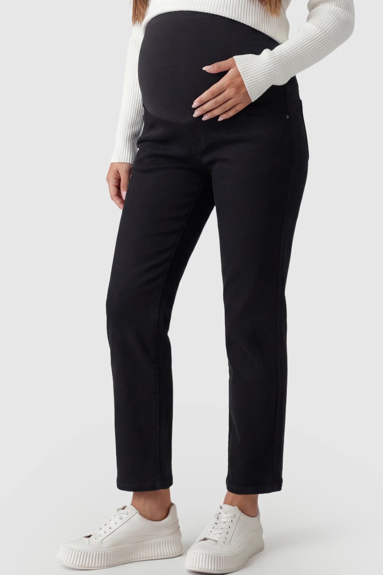 Elastic Full Panel Straight Leg Maternity Jeans Elastic Full Panel Straight Leg Maternity Jeans in Black featuring a high-stretch jersey waistband on a pregnant model showing front.