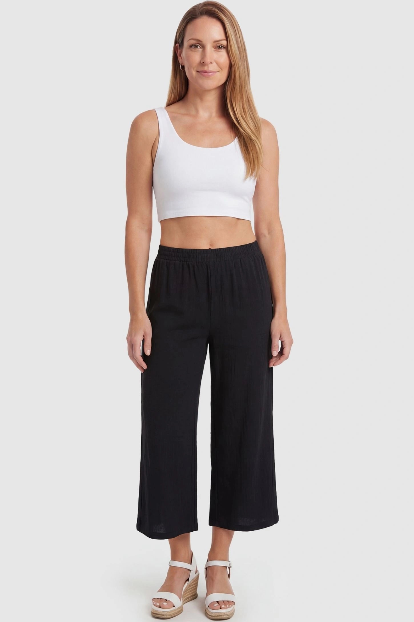 Elastic High Waisted Cropped Maternity Pants Elastic High Waisted Cropped Maternity Pants in Black featuring a transitional fit on a non-pregnant model, front view.