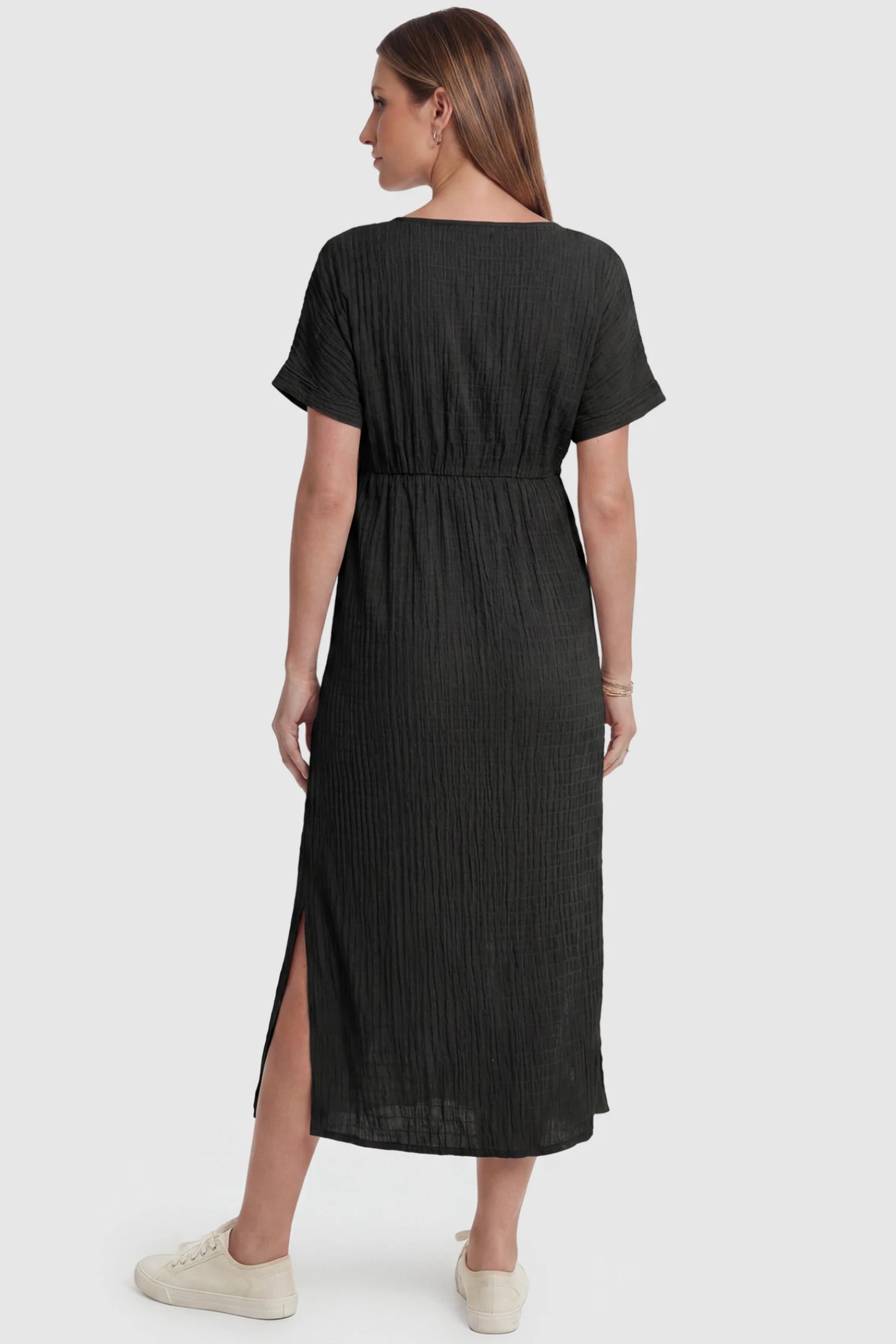 Empire Waist Round Neck Maternity Midi Dress Empire Waist Round Neck Maternity Midi Dress in Black featuring empire waist and short sleeves on a pregnant model, back view.