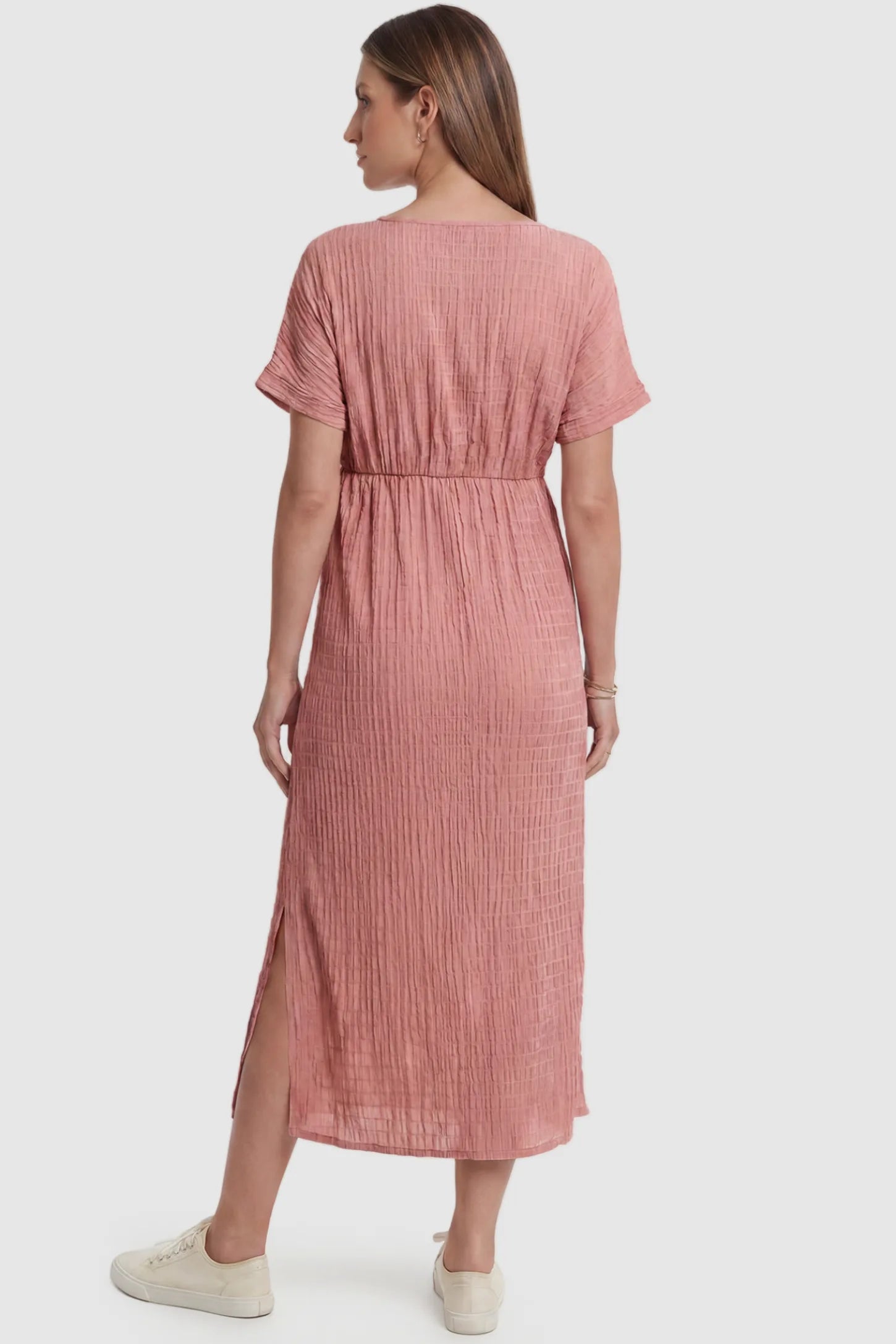 Empire Waist Round Neck Maternity Midi Dress Empire Waist Round Neck Maternity Midi Dress in Pink featuring empire waist and short sleeves on a pregnant model, back view.