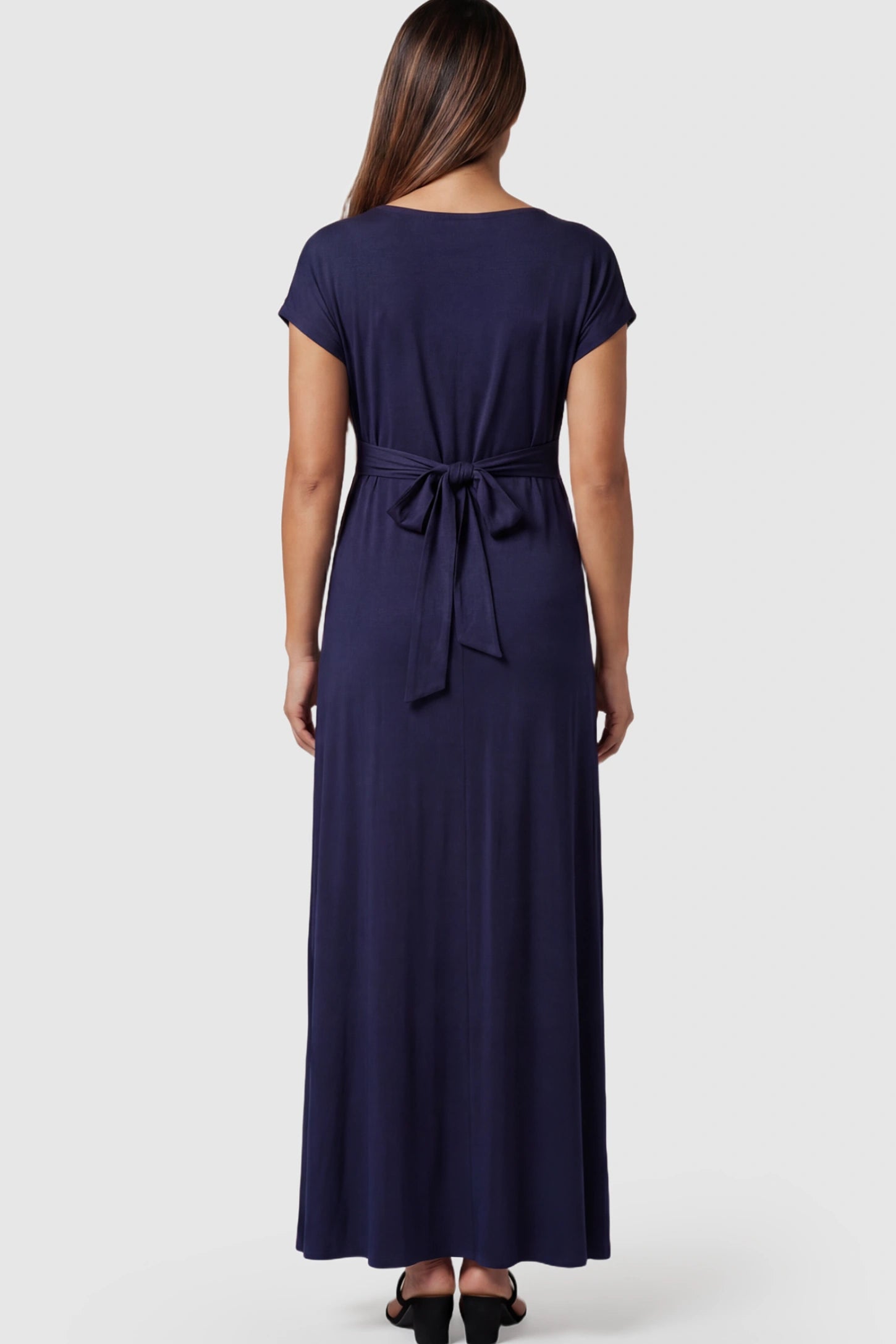 Empire Waist Short Sleeve Maternity Nursing Maxi Dress Empire Waist Short Sleeve Maternity Nursing Maxi Dress featuring tie back detail in dark blue on a pregnant model showing back.