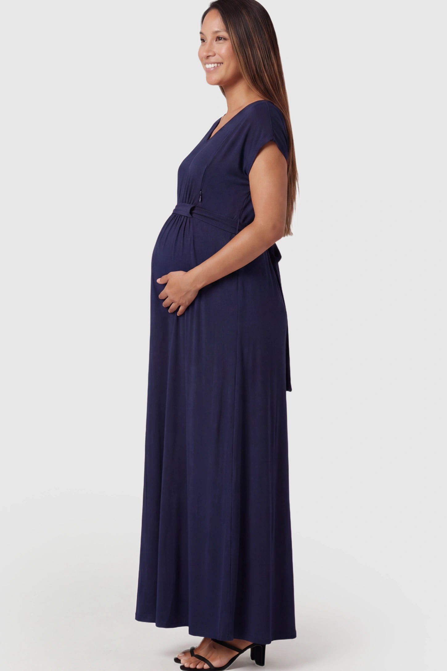 Empire Waist Short Sleeve Maternity Nursing Maxi Dress Empire Waist Short Sleeve Maternity Nursing Maxi Dress featuring hidden breastfeeding zippers in dark blue on a pregnant model showing side.