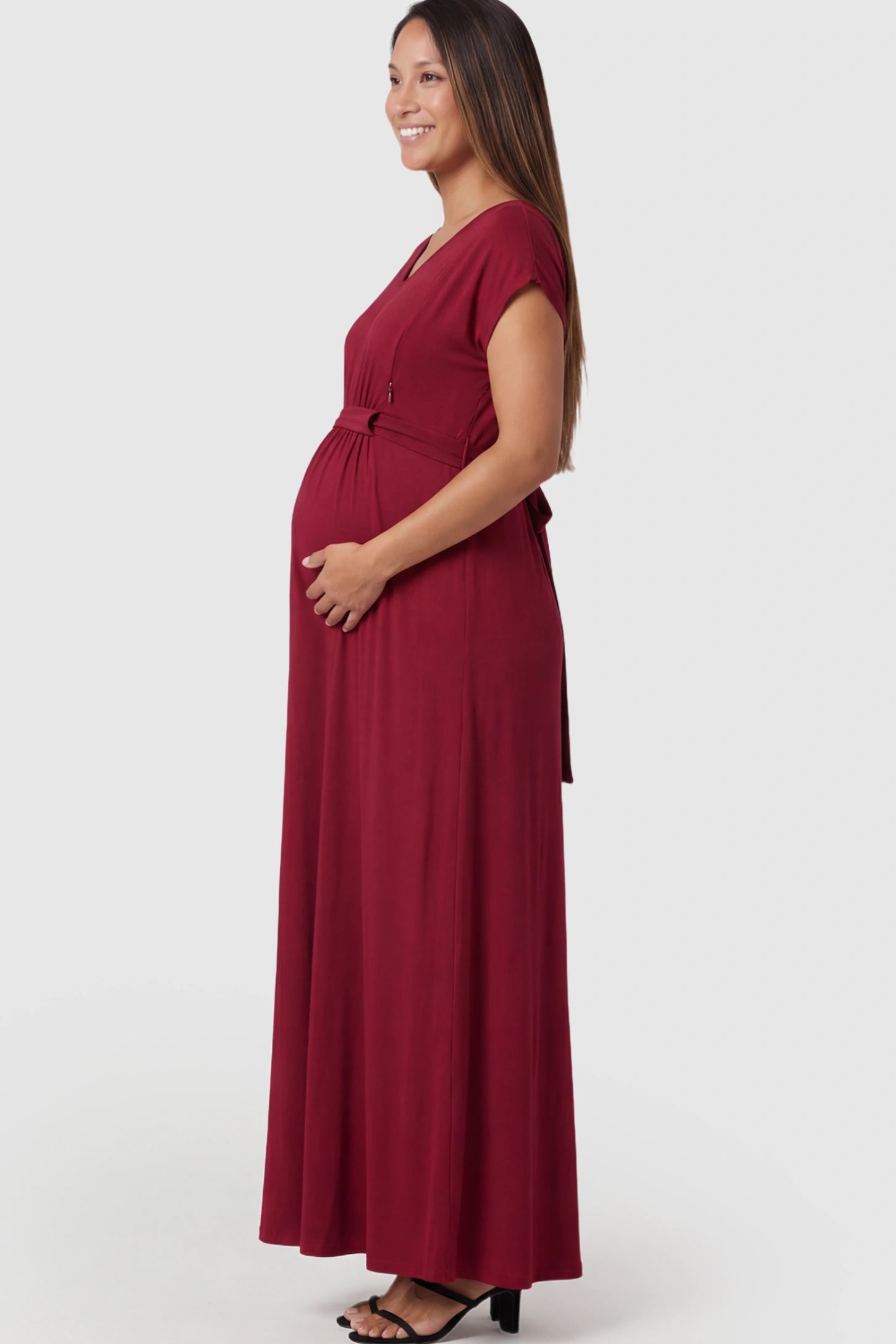 Empire Waist Short Sleeve Maternity Nursing Maxi Dress Empire Waist Short Sleeve Maternity Nursing Maxi Dress featuring hidden breastfeeding zippers in wine red on a pregnant model showing side.