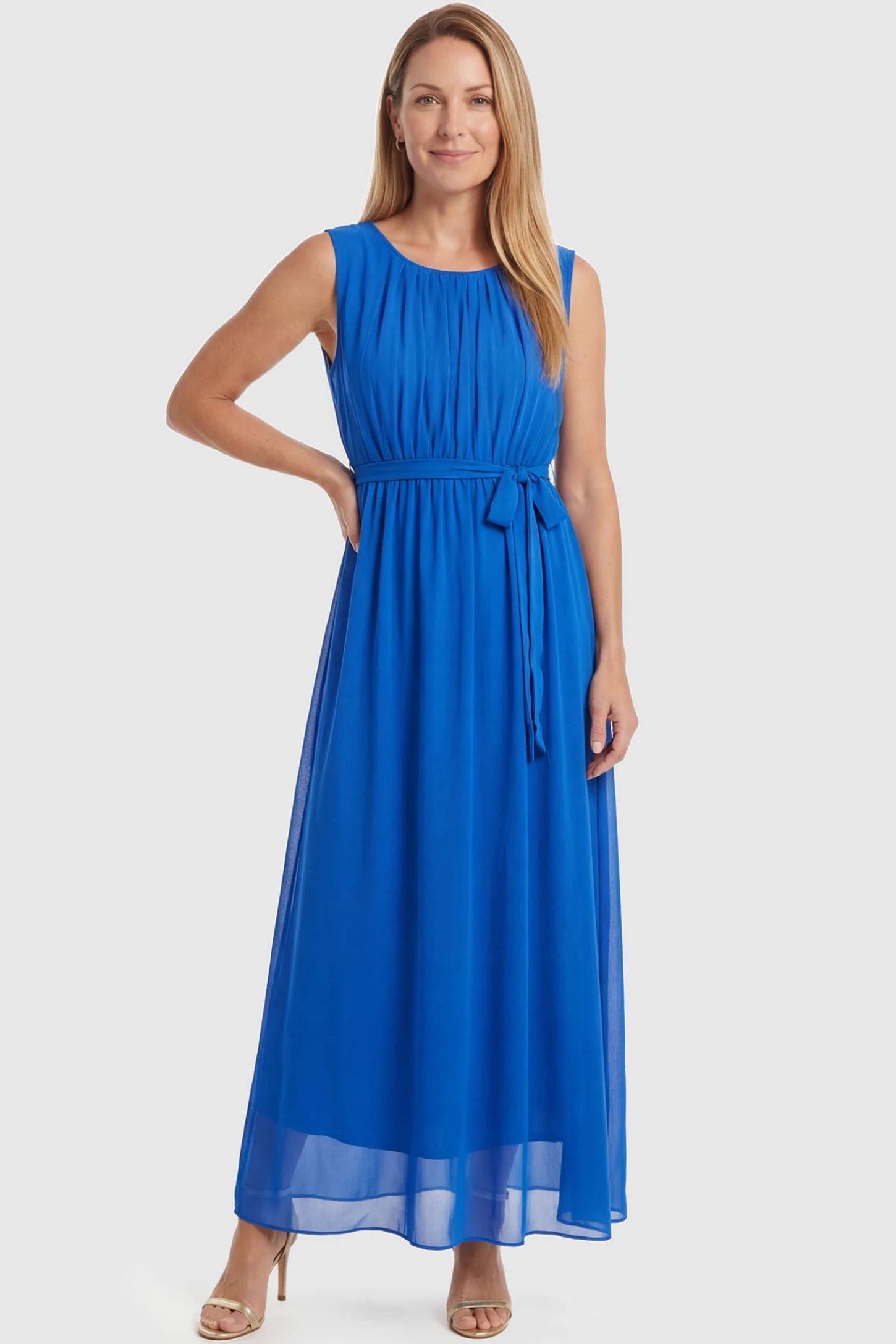 Empire Waist Tie-Front Sleeveless Maternity Maxi Dress Empire Waist Tie-Front Sleeveless Maternity Maxi Dress in Blue featuring a tie front and empire waist on a postpartum model front view.