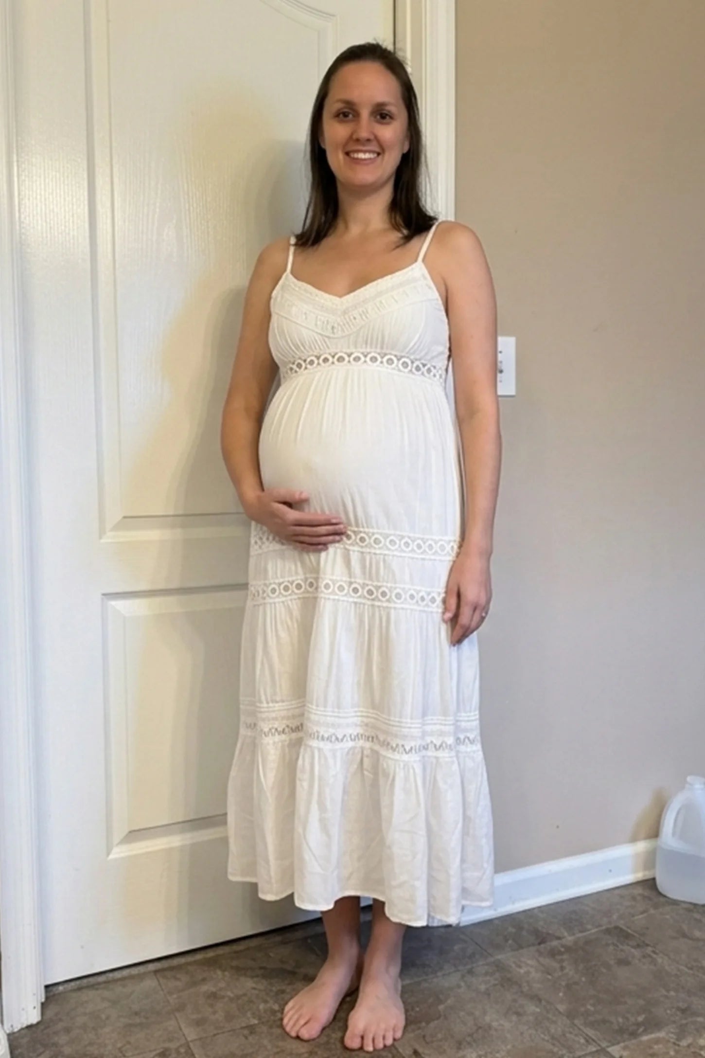 Eyelet Lace Cami Midi Maternity Dress Eyelet Lace Cami Midi Maternity Dress in White featuring circle eyelet lace trim on a pregnant model, UGC view.