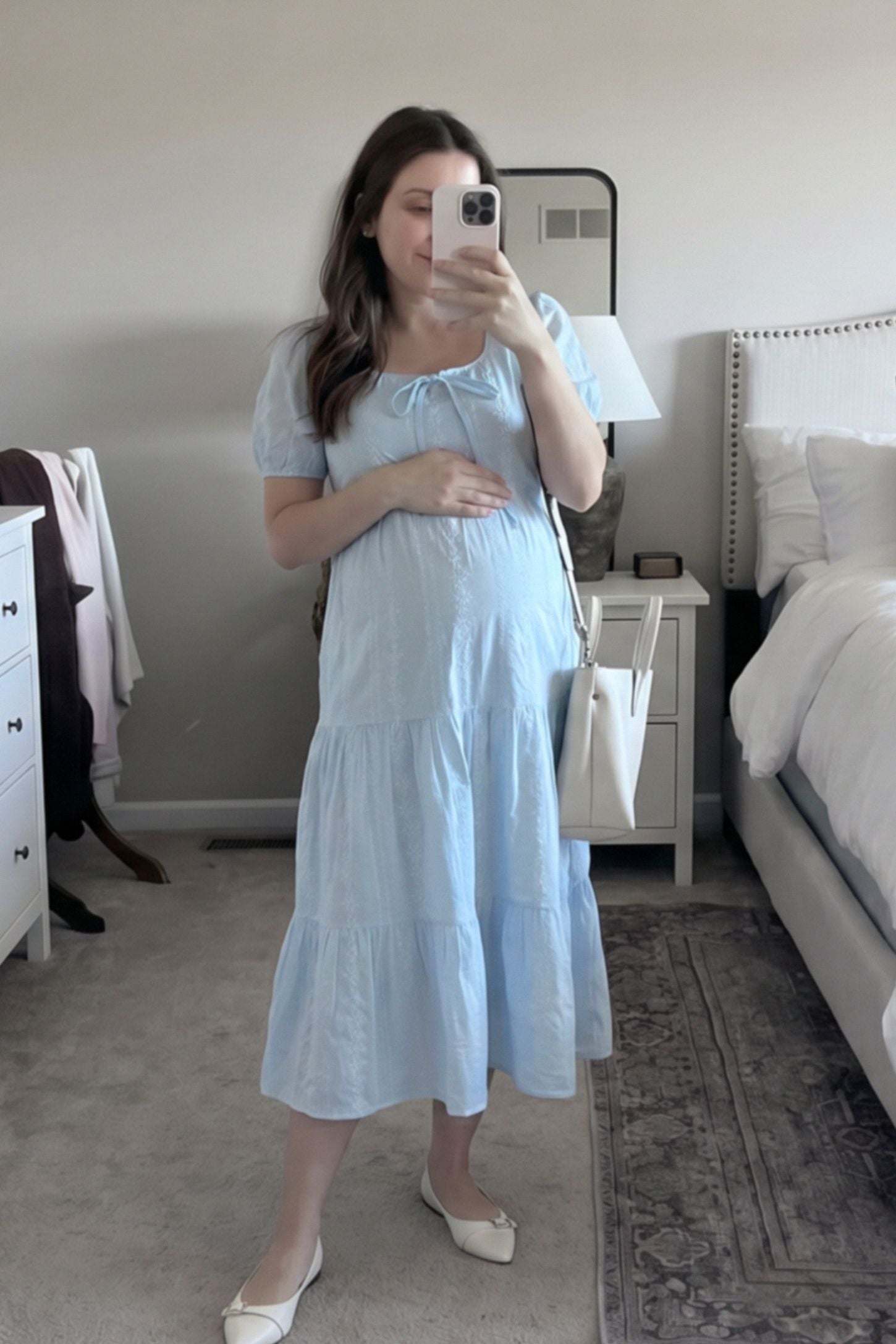Eyelet Scoop Neck Tiered Maternity Dress Eyelet Scoop Neck Tiered Maternity Dress in Blue featuring puff sleeves on a pregnant model, front view.