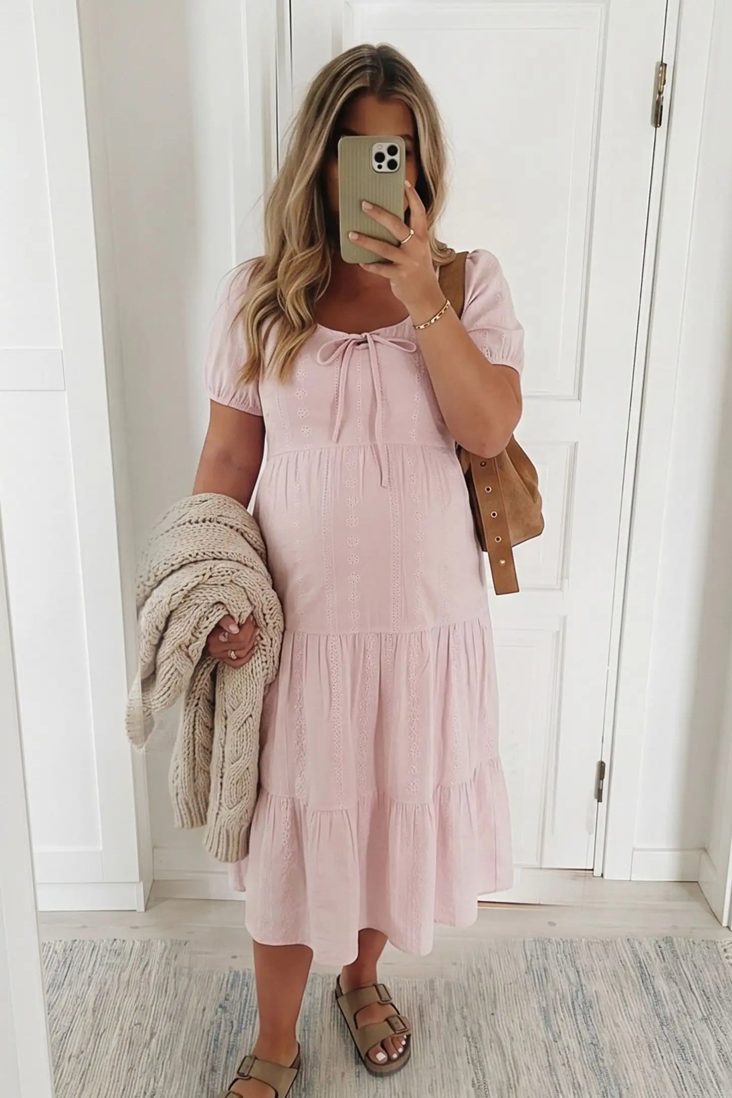 Eyelet Scoop Neck Tiered Maternity Dress Eyelet Scoop Neck Tiered Maternity Dress in Pink featuring puff sleeves on a pregnant model, front view.