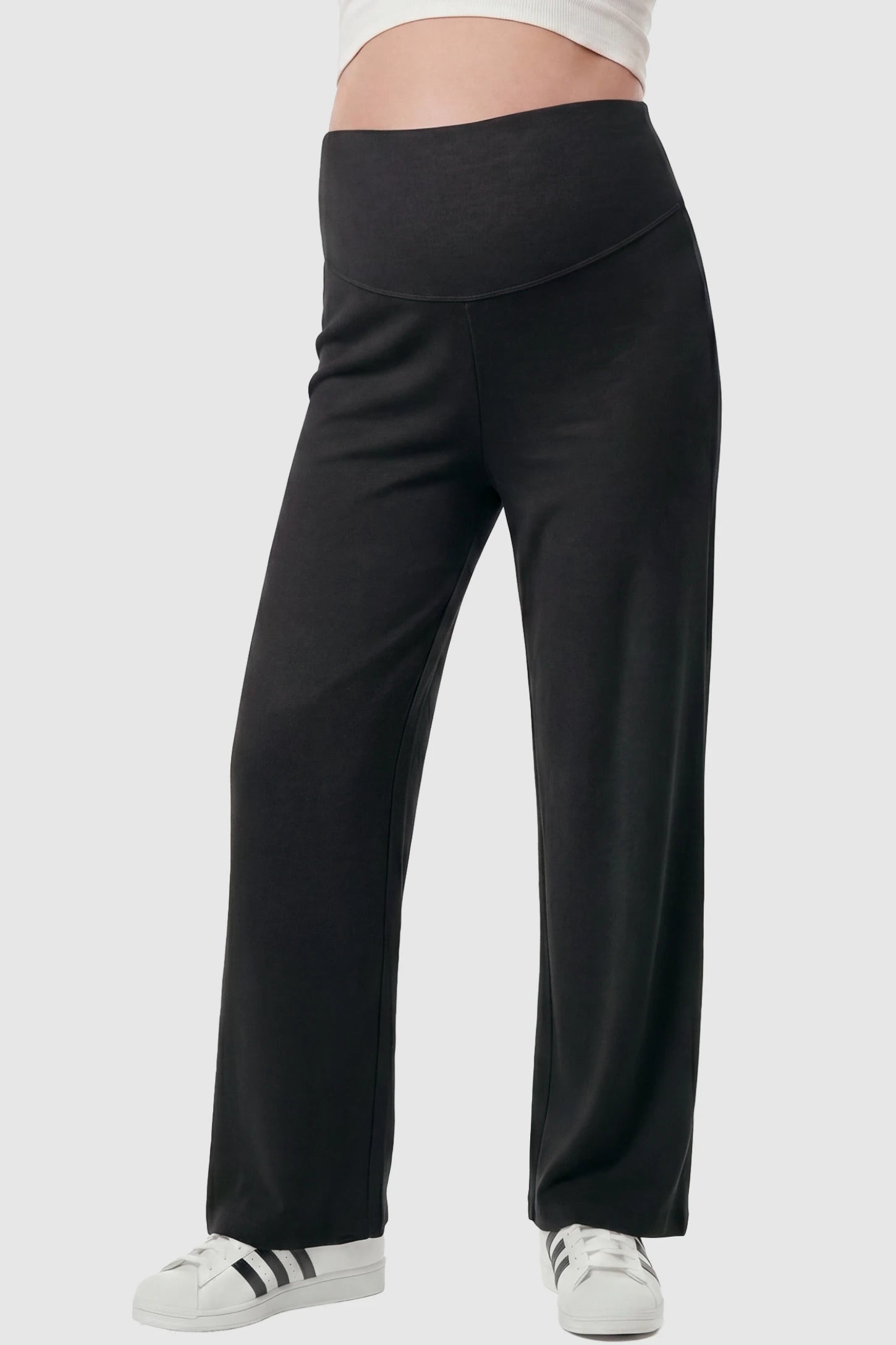 Fleece Straight-Leg Maternity Pants in Black featuring a soft elastic waistband on a pregnant model, front view.