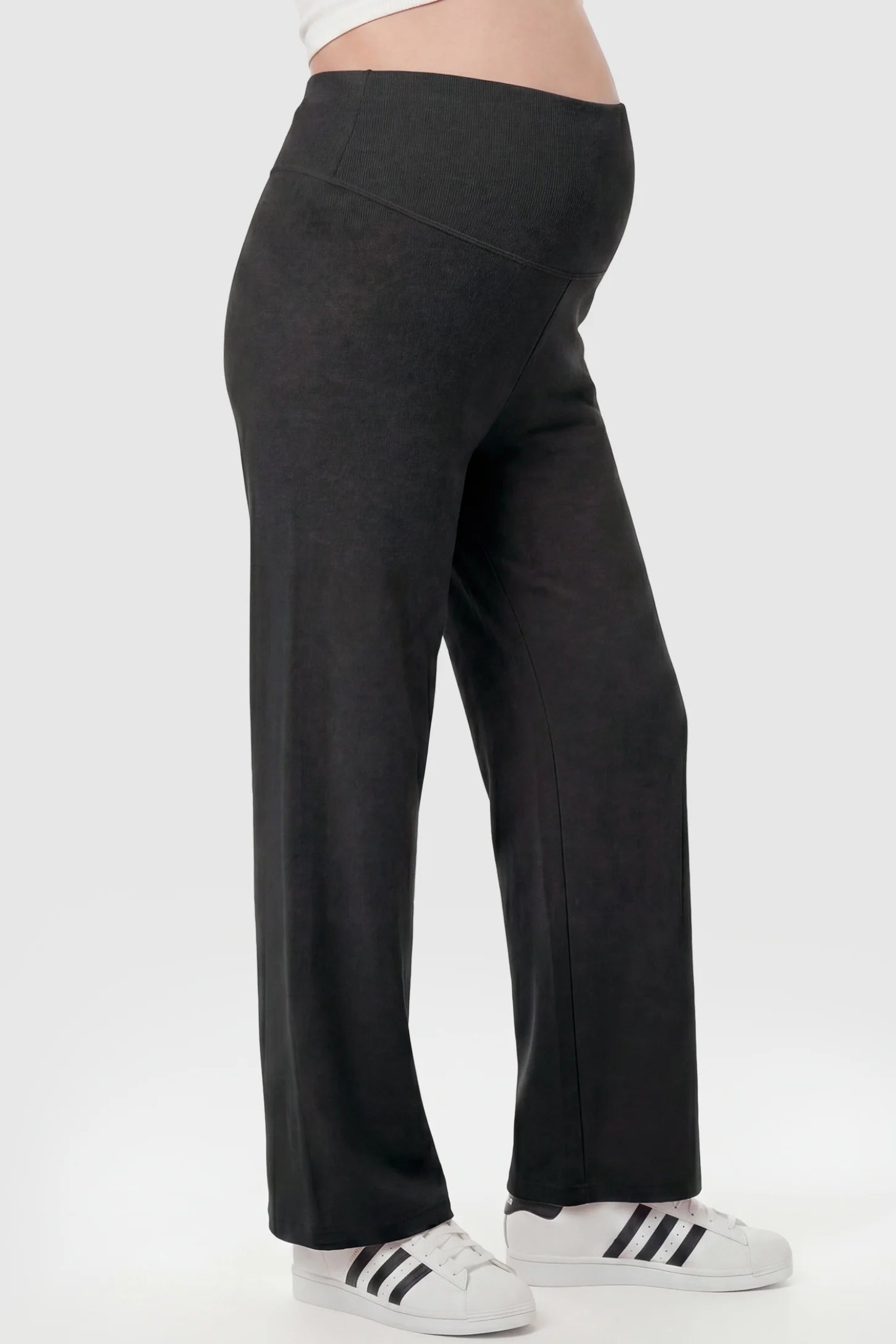 Fleece Straight-Leg Maternity Pants Fleece Straight-Leg Maternity Pants in Black featuring a relaxed straight-leg cut on a pregnant model, side view.