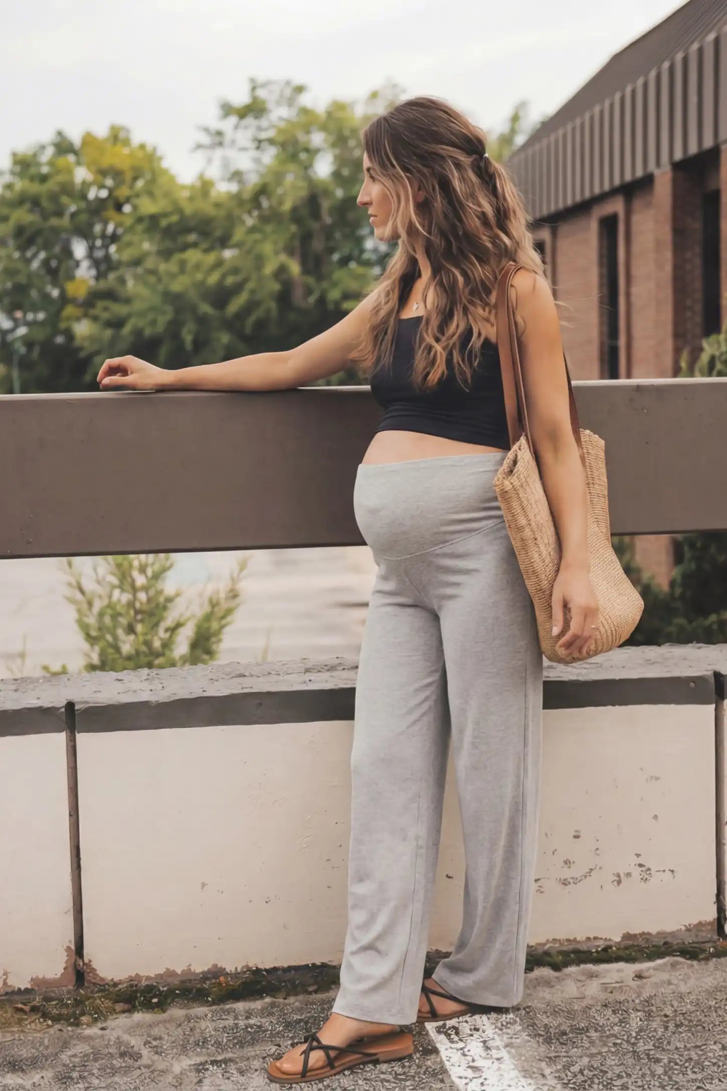 Fleece Straight-Leg Maternity Pants Fleece Straight-Leg Maternity Pants in Light Gray featuring a relaxed straight-leg cut on a pregnant model, side view.