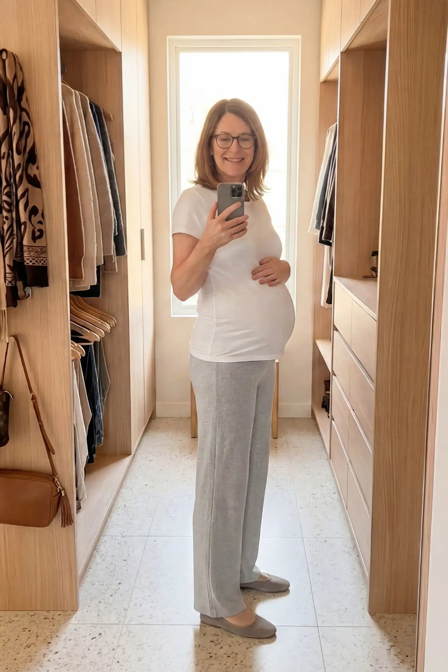 Fleece Straight-Leg Maternity Pants Fleece Straight-Leg Maternity Pants in Light Gray featuring a relaxed straight-leg cut on a pregnant model, side view.
