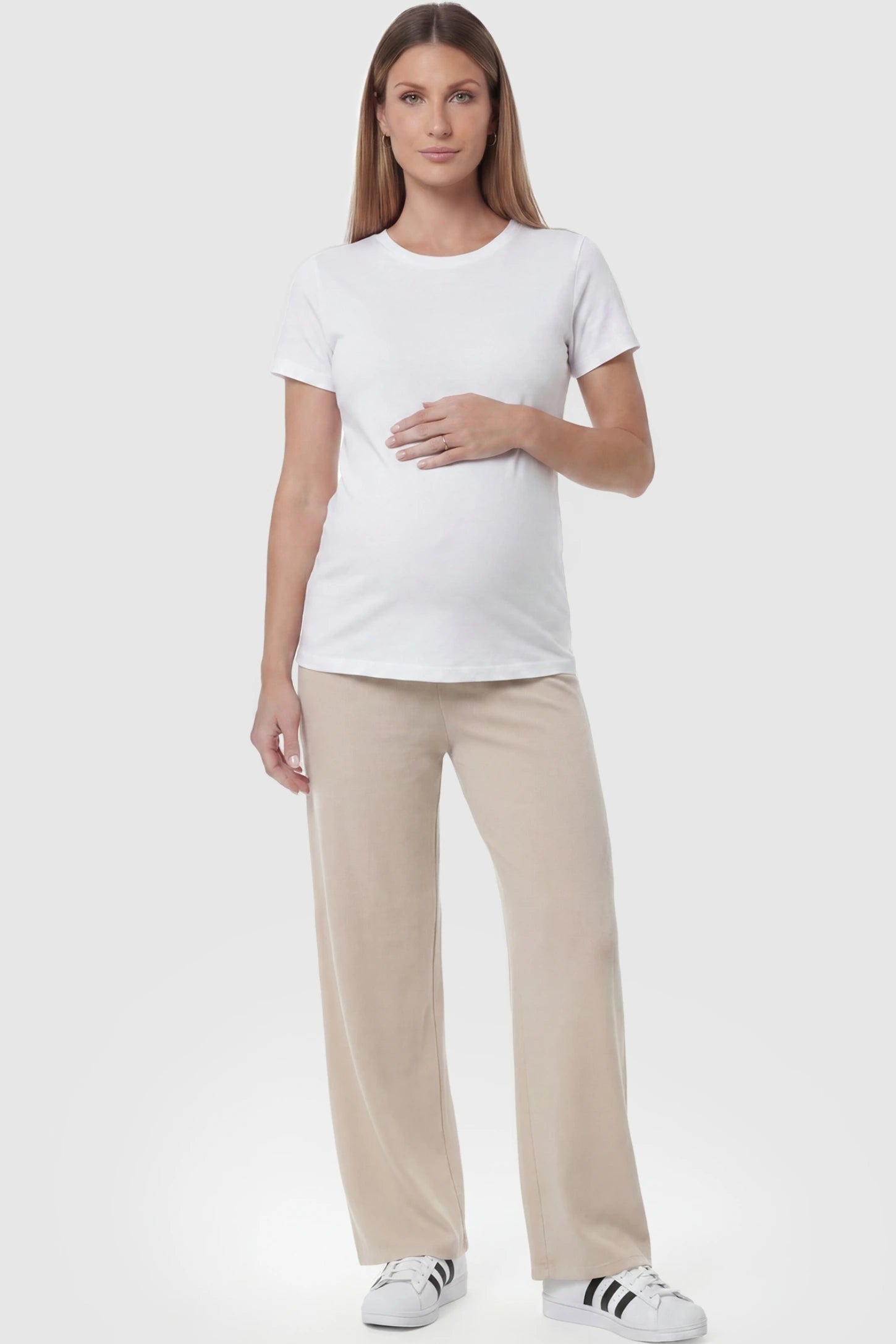 Fleece Straight-Leg Maternity Pants Fleece Straight-Leg Maternity Pants in Off-White featuring a relaxed straight-leg cut on a pregnant model, front view.