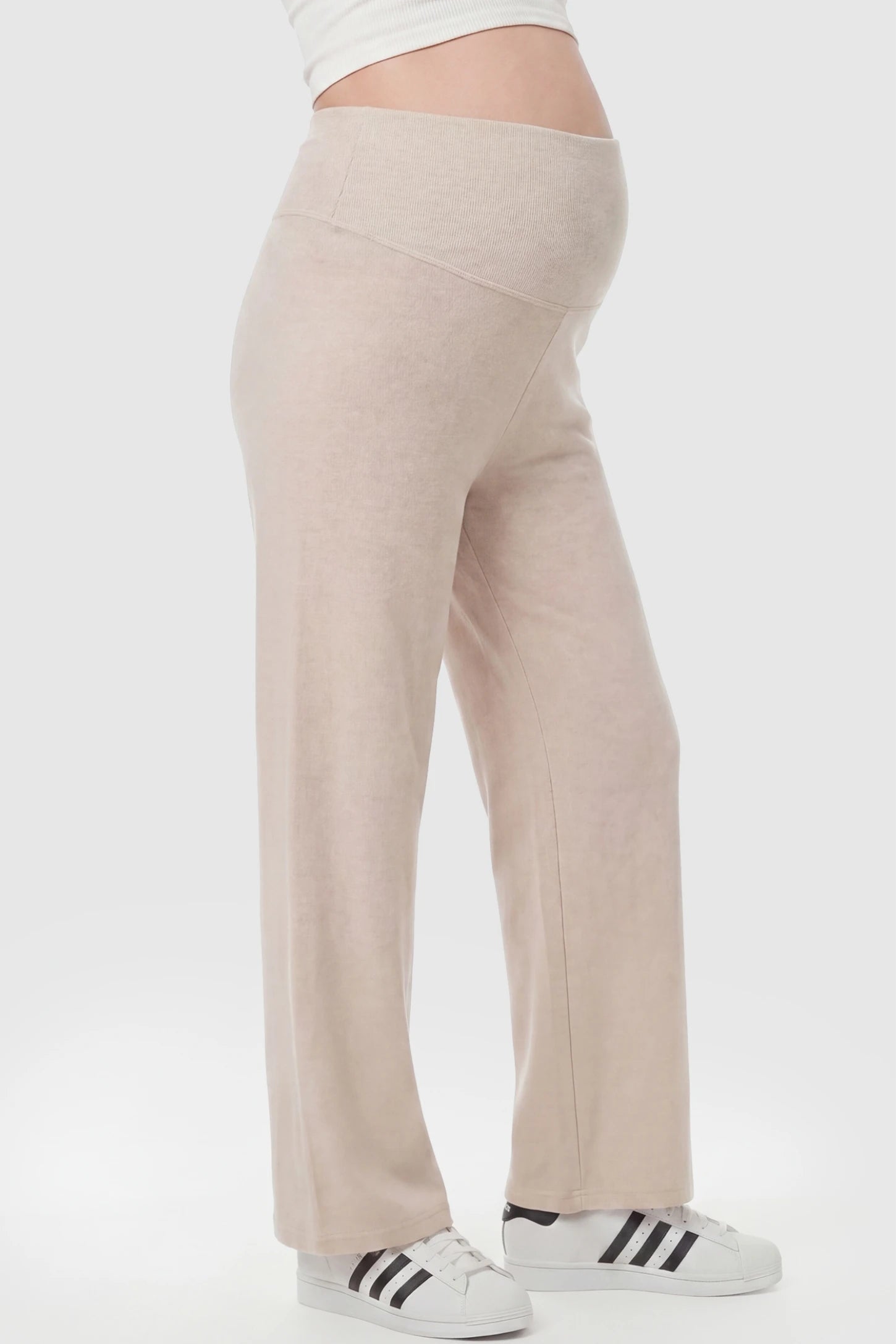Fleece Straight-Leg Maternity Pants Fleece Straight-Leg Maternity Pants in Off-White featuring a relaxed straight-leg cut on a pregnant model, side view.