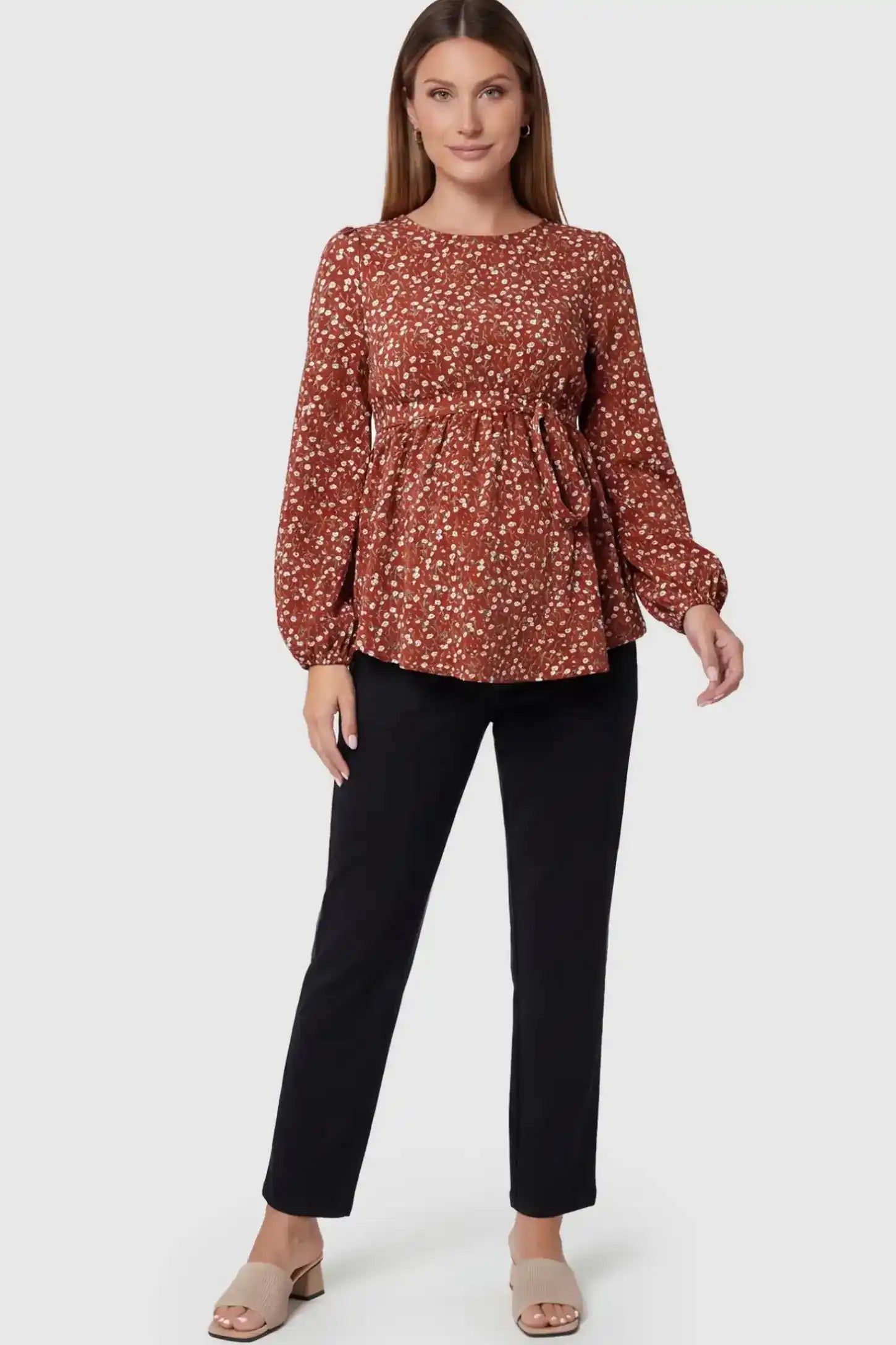 Floral Round Neck Babydoll Maternity Top Floral Round Neck Babydoll Maternity Top in Red featuring an adjustable waist tie on a pregnant model.