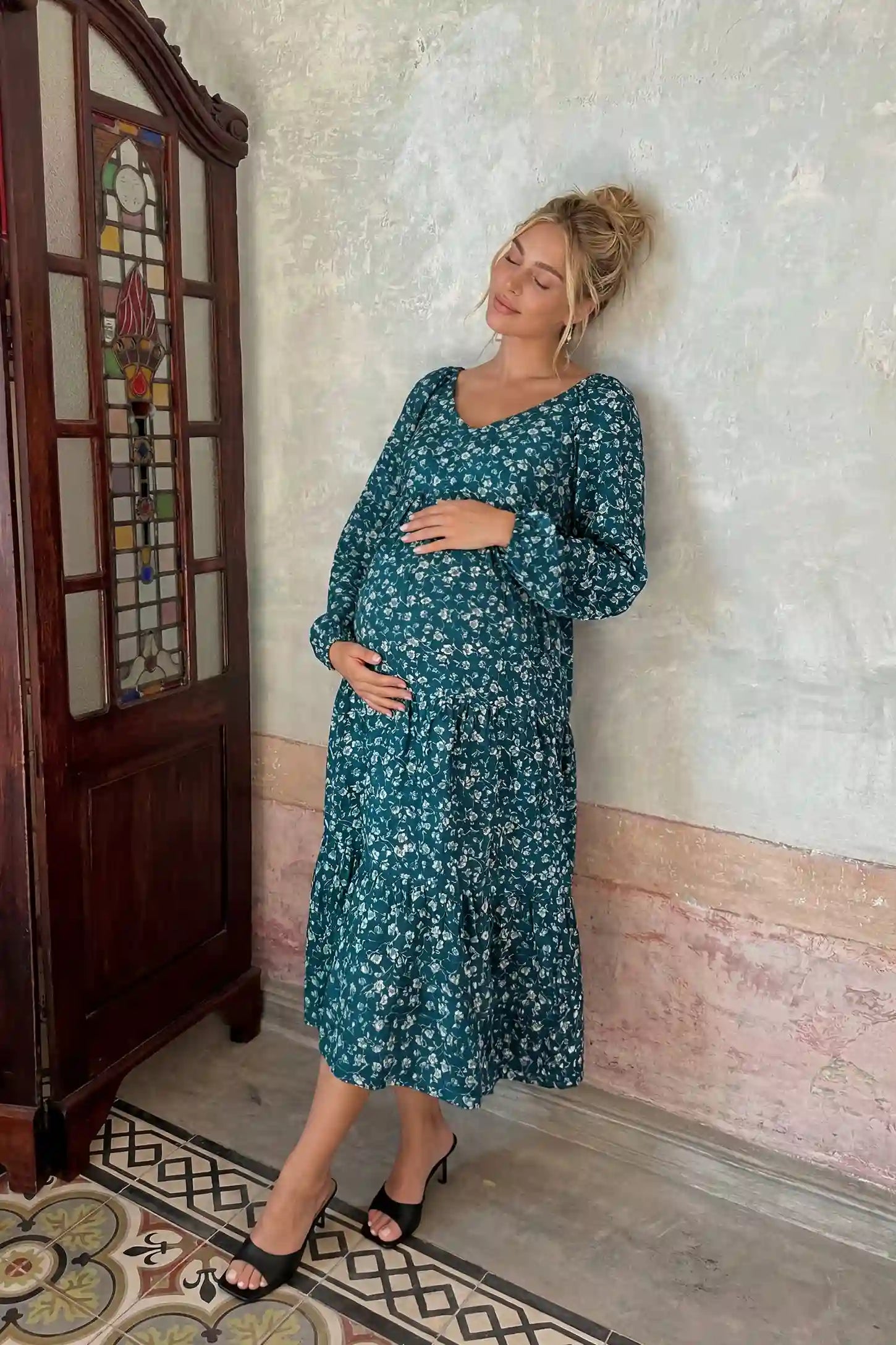 Floral Balloon Sleeves Midi Maternity Dress Blue Floral Balloon Sleeves Midi Maternity Dress featuring a tiered skirt on a front view pregnant model, editorial lifestyle view.