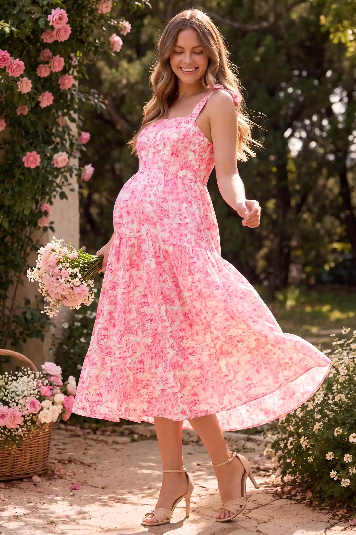 Floral Cami Tiered Maxi Maternity Dress Floral Cami Tiered Maxi Maternity Dress in pink floral featuring a vibrant floral pattern and layered tiers, lifestyle view on a pregnant model.