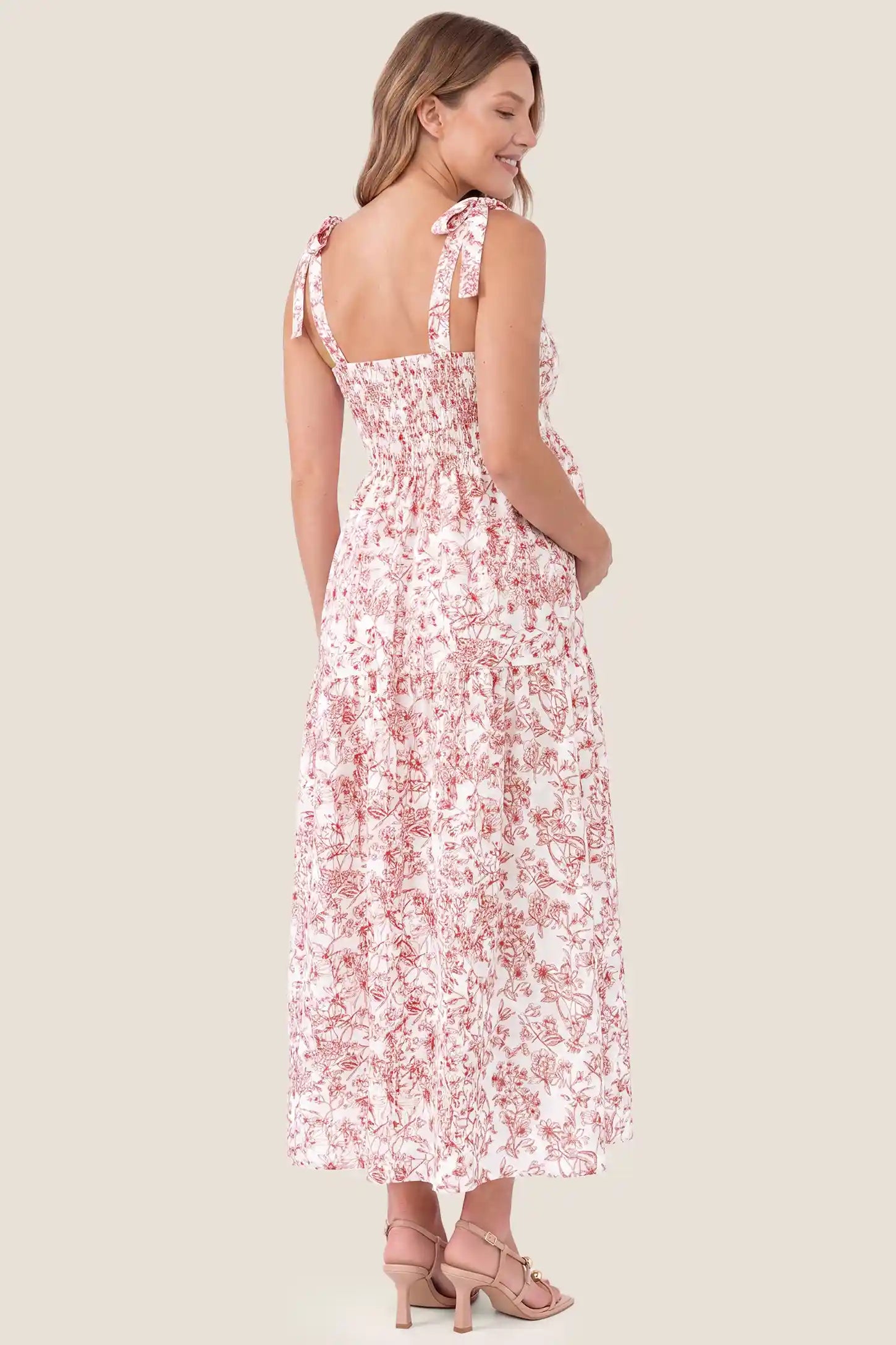 Floral Cami Tiered Maxi Maternity Dress Floral Cami Tiered Maxi Maternity Dress in Rusty French Floral showcasing the flowy tiered back drape, back view on a pregnant model.