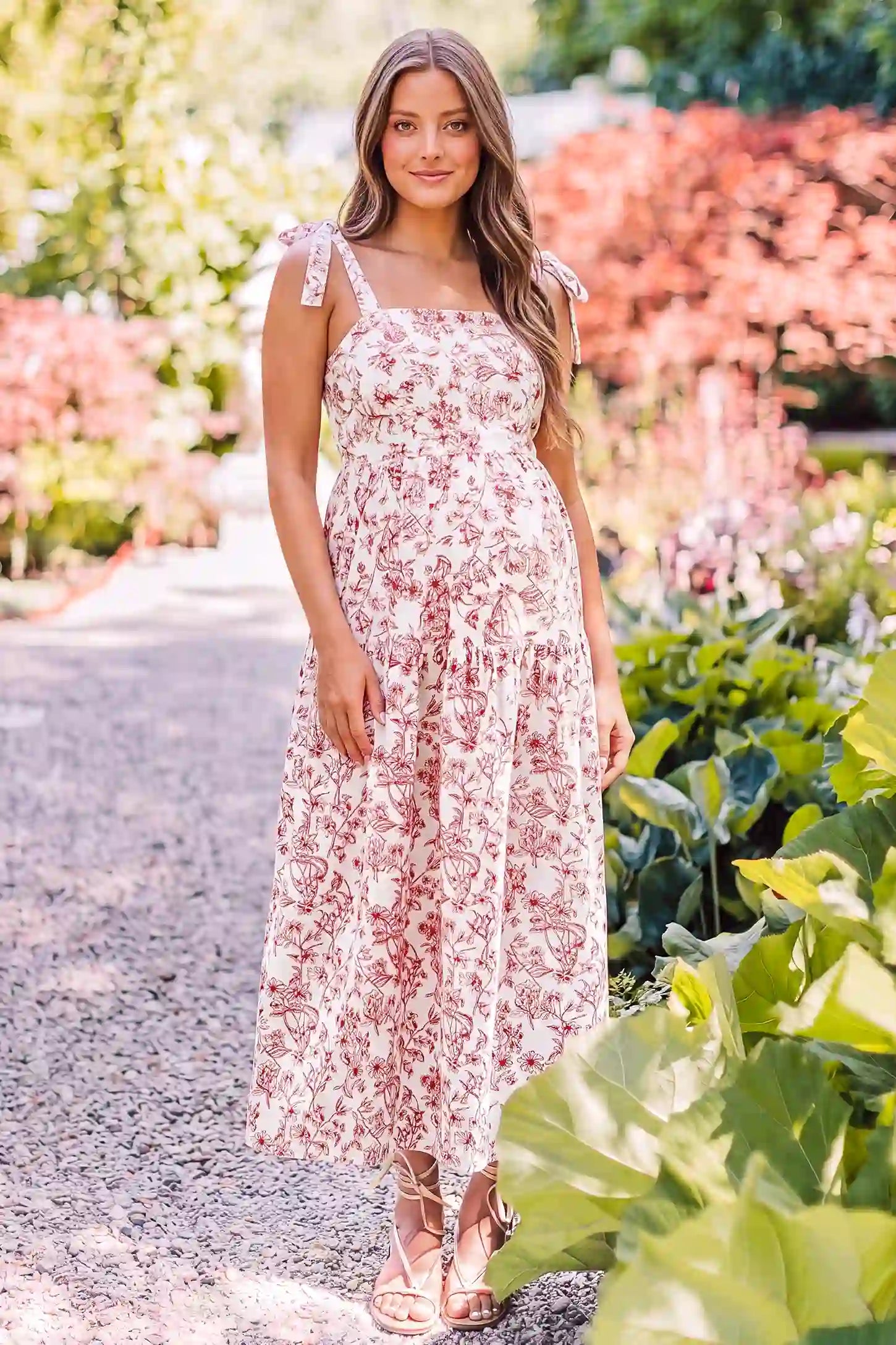Floral Cami Tiered Maxi Maternity Dress Floral Cami Tiered Maxi Maternity Dress in Rusty French Floral with a vintage floral tiered design, lifestyle front view on a pregnant model.