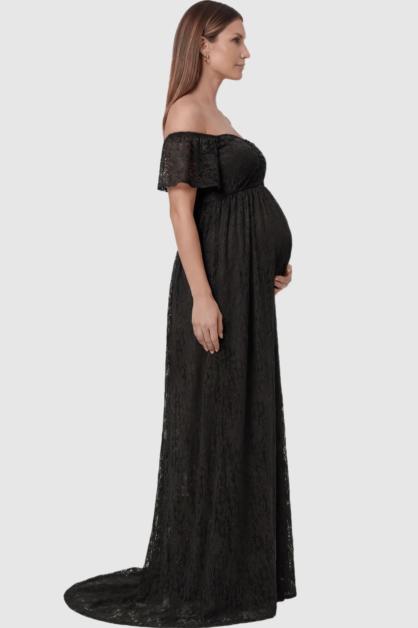 Lace Off Shoulder Maternity Maxi Dress Lace Off Shoulder Maternity Maxi Dress in Black featuring off the shoulder neckline on a pregnant model showing side.